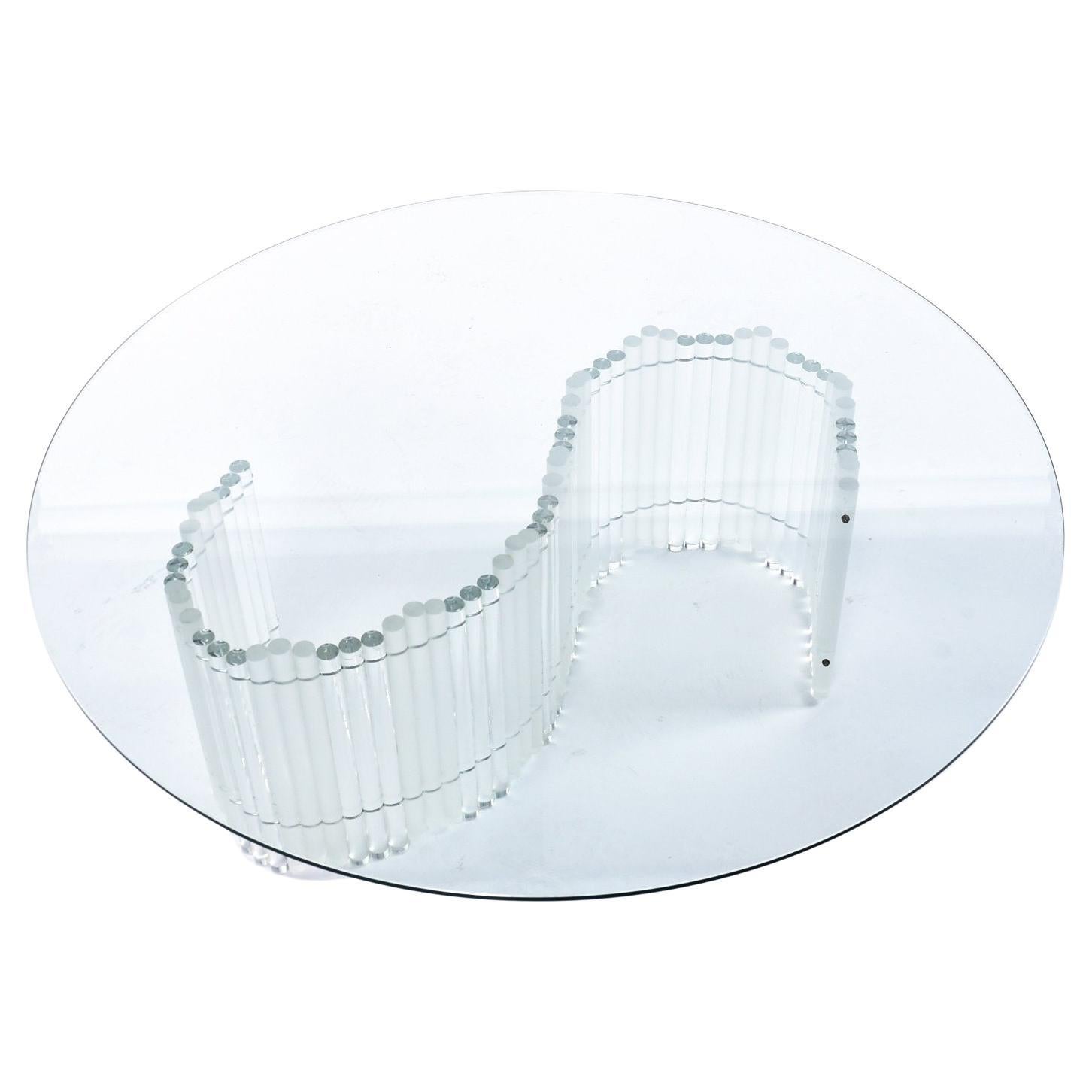 Luxurious serpentine Lucite coffee table base topped with a large 48