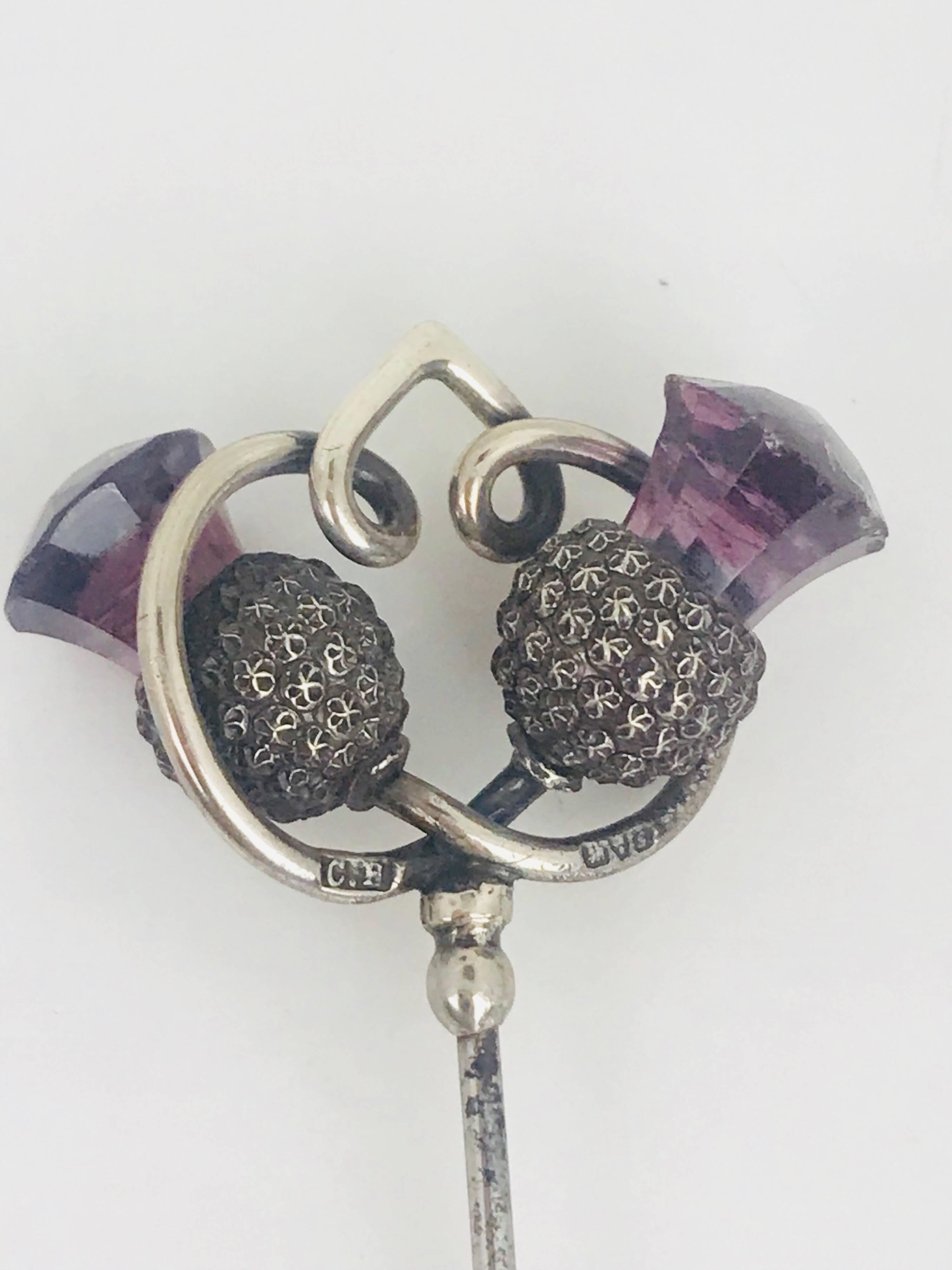 Pair of Victorian hat pins , rare to find a set, with a rosebud motif, made of sterling silver and amethyst colored purple glass, hallmarked with the letters 
