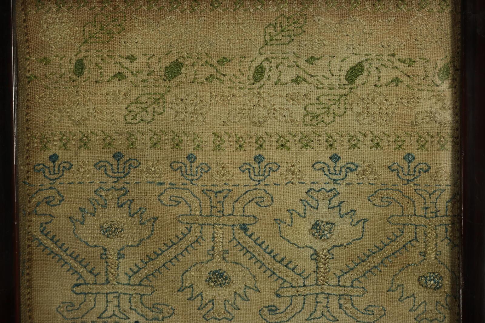 1649 band sampler by HW aged 8, worked in silks on linen ground, in a variety of fine stitches including raised work and Algerian eye. Simple line borders, multiple traditional complex design bands, one with motifs including frog, strawberry plant,