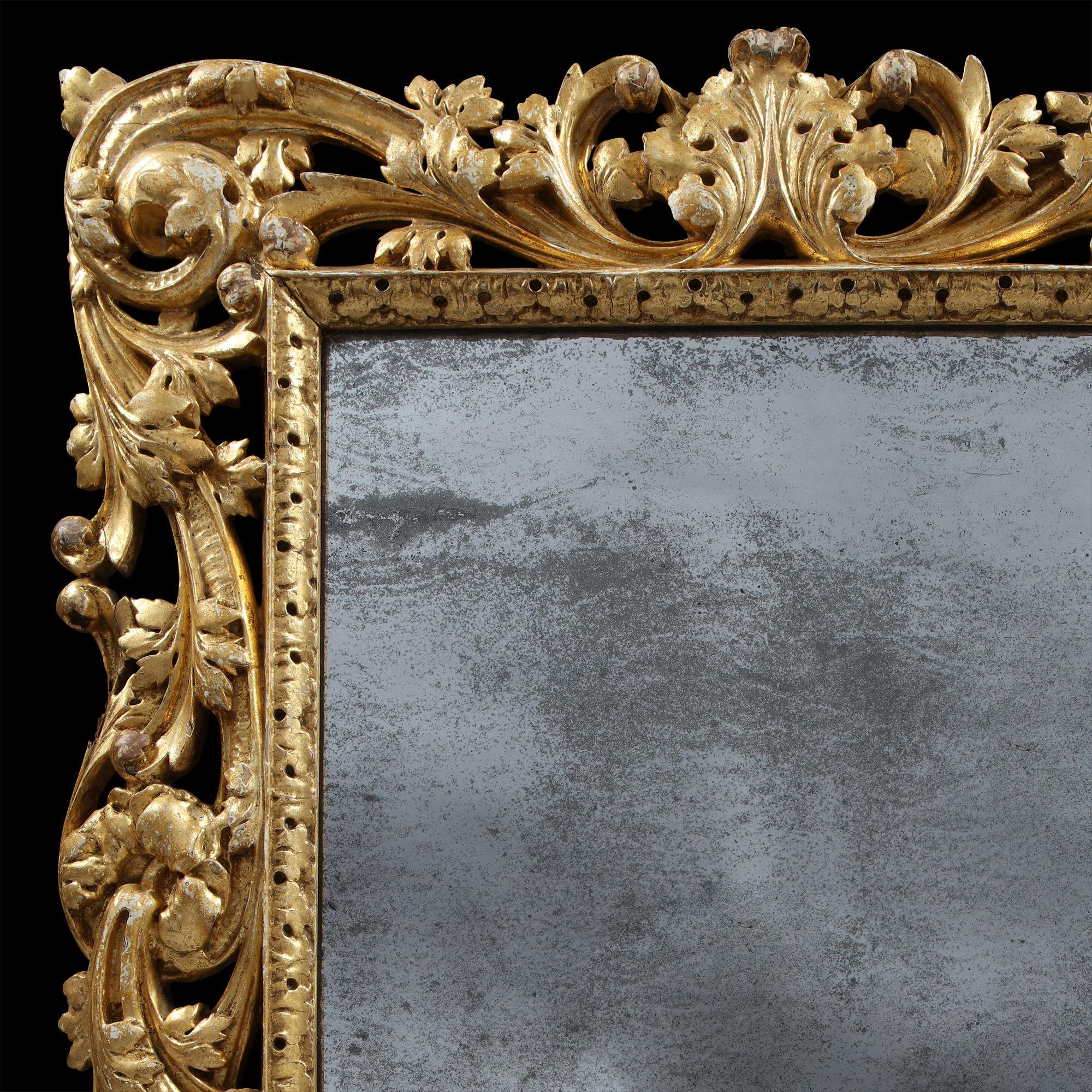 Superb Charles II giltwood mirror with asymmetrical foliate scrolls and leaf boarder. The mirror is both beautiful and remarkable surviving since the last quarter of the 17th century.


 