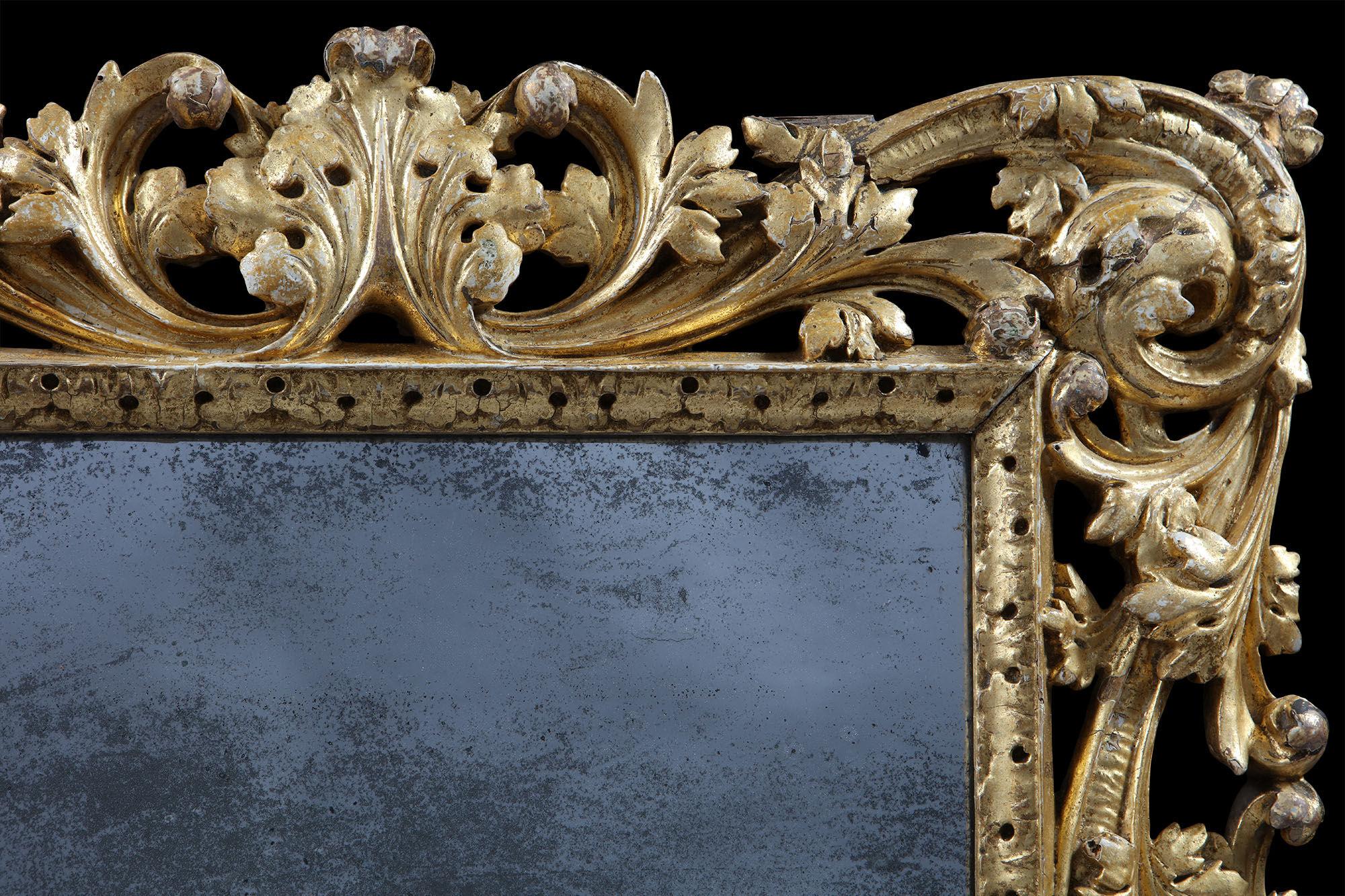 English Charles II Giltwood Mirror with Asymmetrical Foliate Scrolls and Leaf Boarder
