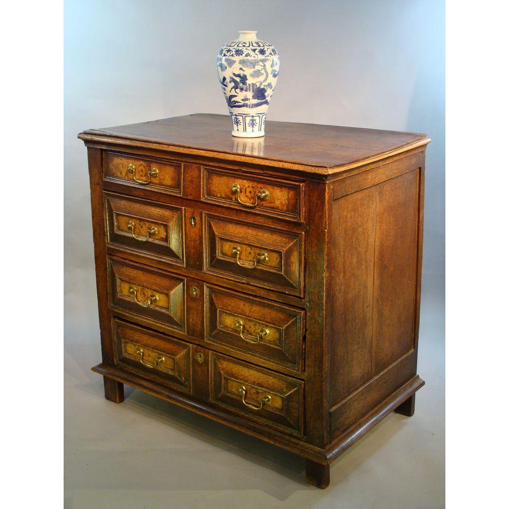Charles II period (1630-1685) oak and walnut chest of drawers, or commode. 
Retaining old waxed surfaces of very good rich color and patination.

With typical geometric drawer fronts and side runners, confirming a late 17th century date of c 1680.