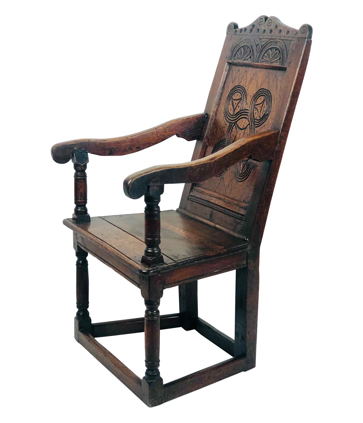A late 17th century English Charles II oak carved armchair, circa 1680. These are rare and early examples of English furniture.

 