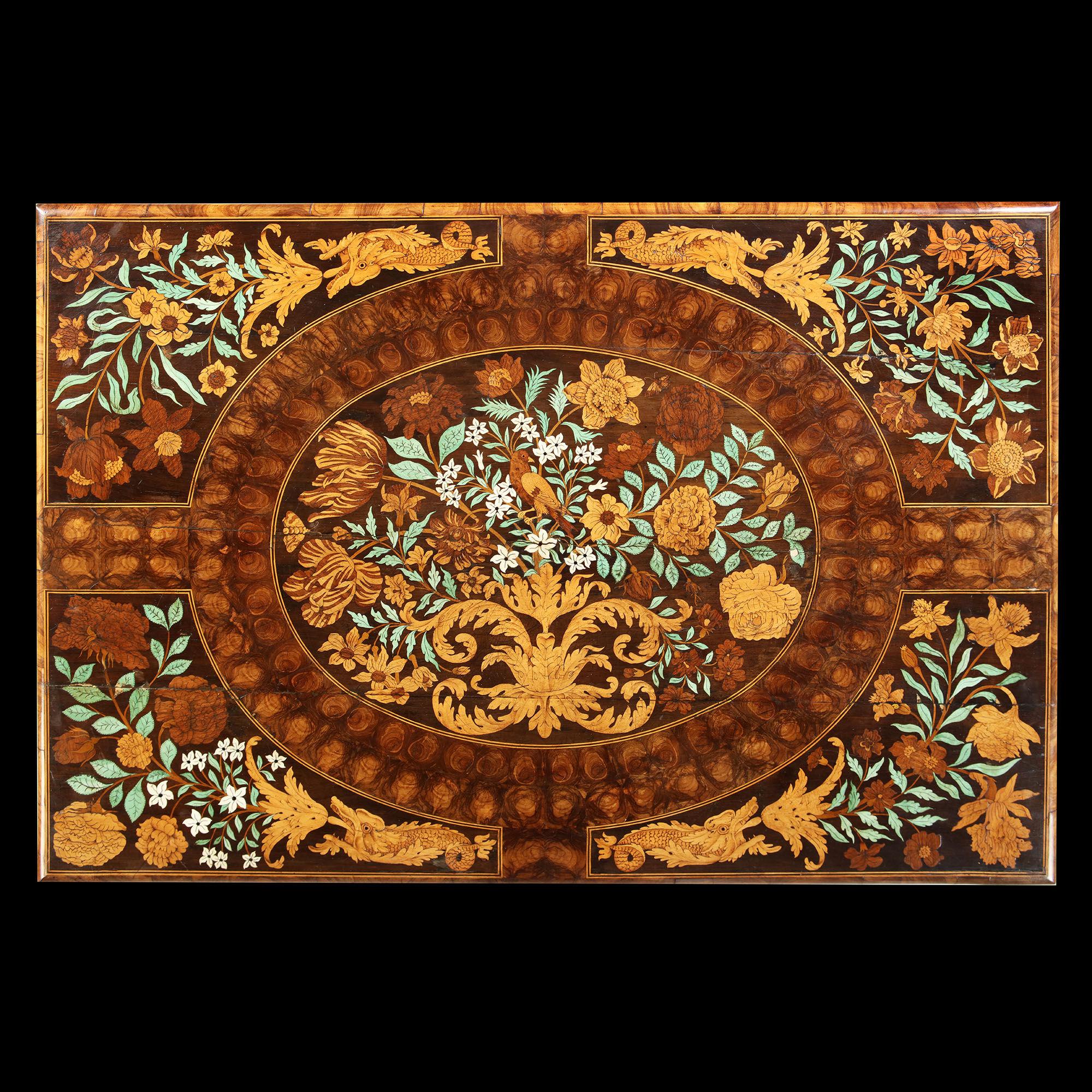 Charles II olive oyster floral marquetry table, attributed to Gerrit Jensen in Association with Gole.

This accomplished Charles II marquetry table clearly bears the influence of Dutch and French masters of marquetry working in the last quarter of