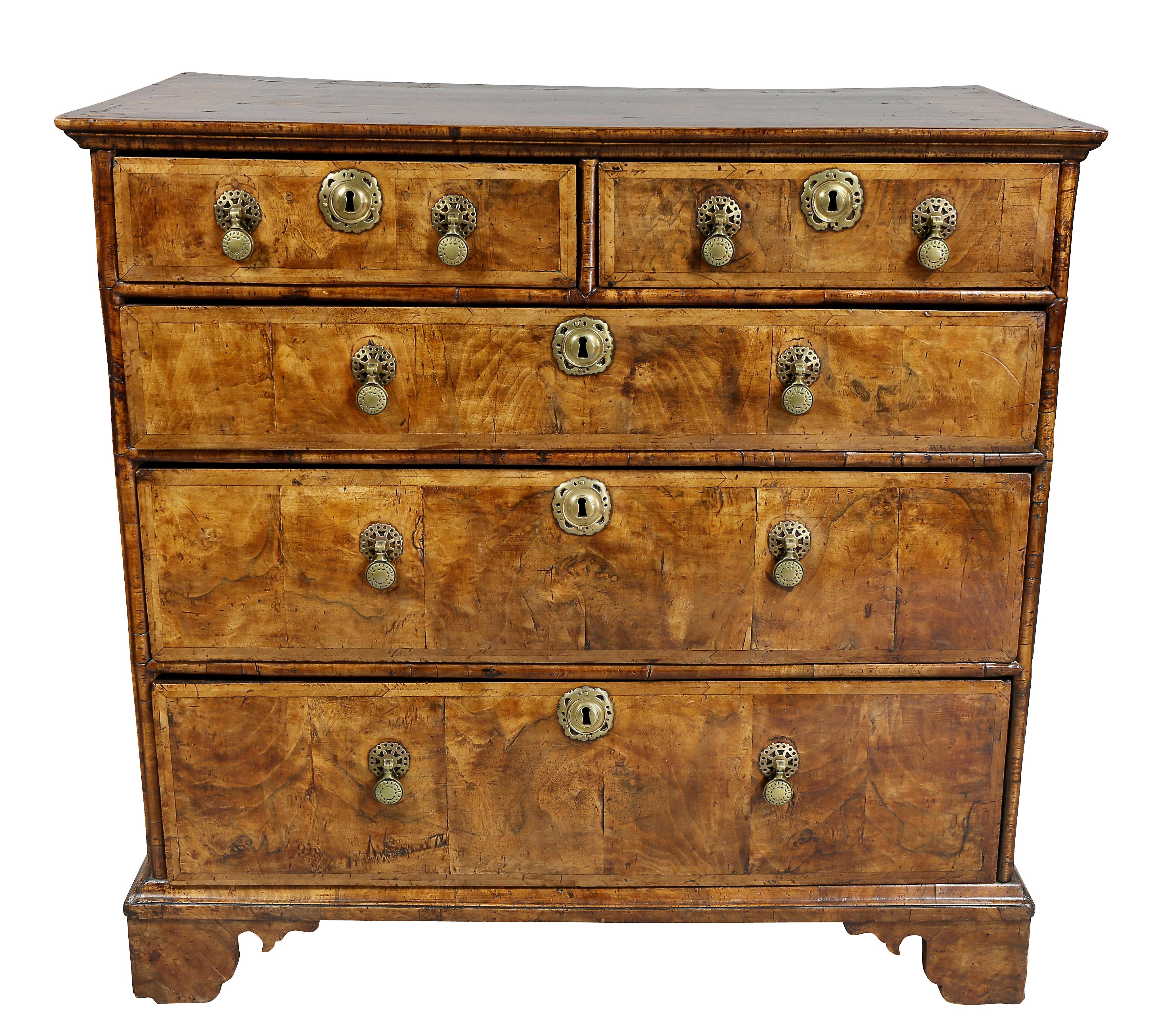 With beautifully figured walnut and gorgeous brown color, unusual handles and bracket feet.