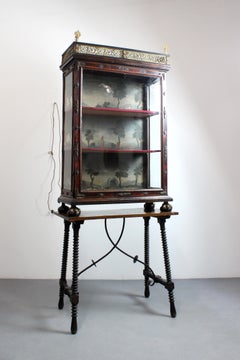 Charles III style ebonized wood display case with bronze mounts and polychrome