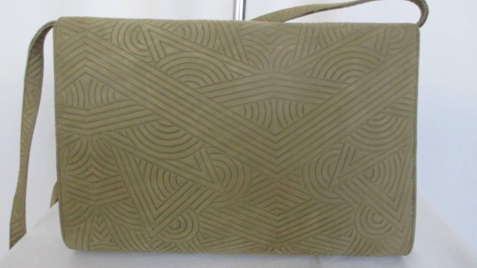 Vintage Art-Deco Charles Jourdan Paris bag -collectors item- 

We offer more exclusive vintage items, view our frontstore

Details:
Color and material:  green suede printed leather with silver/gold aplique.
Inside is made of black leather and has 1