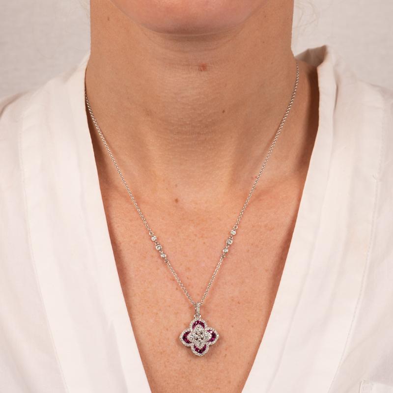 This beautiful necklace from Charles Krypell features 0.93 carat total weight in round diamonds accented by 0.61 carat total weight in round rubies set in 18 karat white gold. The 18 karat white gold 17