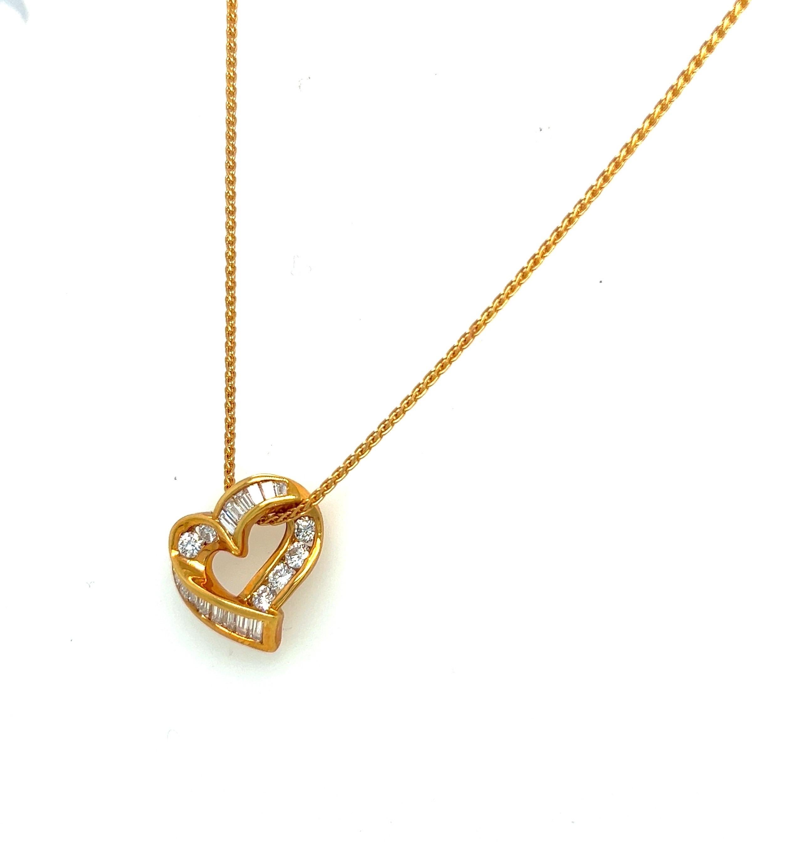 Charles Krypell Jewelry is a New York Based fine jewelry brand that became internationally known for its exquisite use of color, novel designs, and outstanding craftsmanship. 
This 18 karat yellow gold heart is set with invisibly set tapered