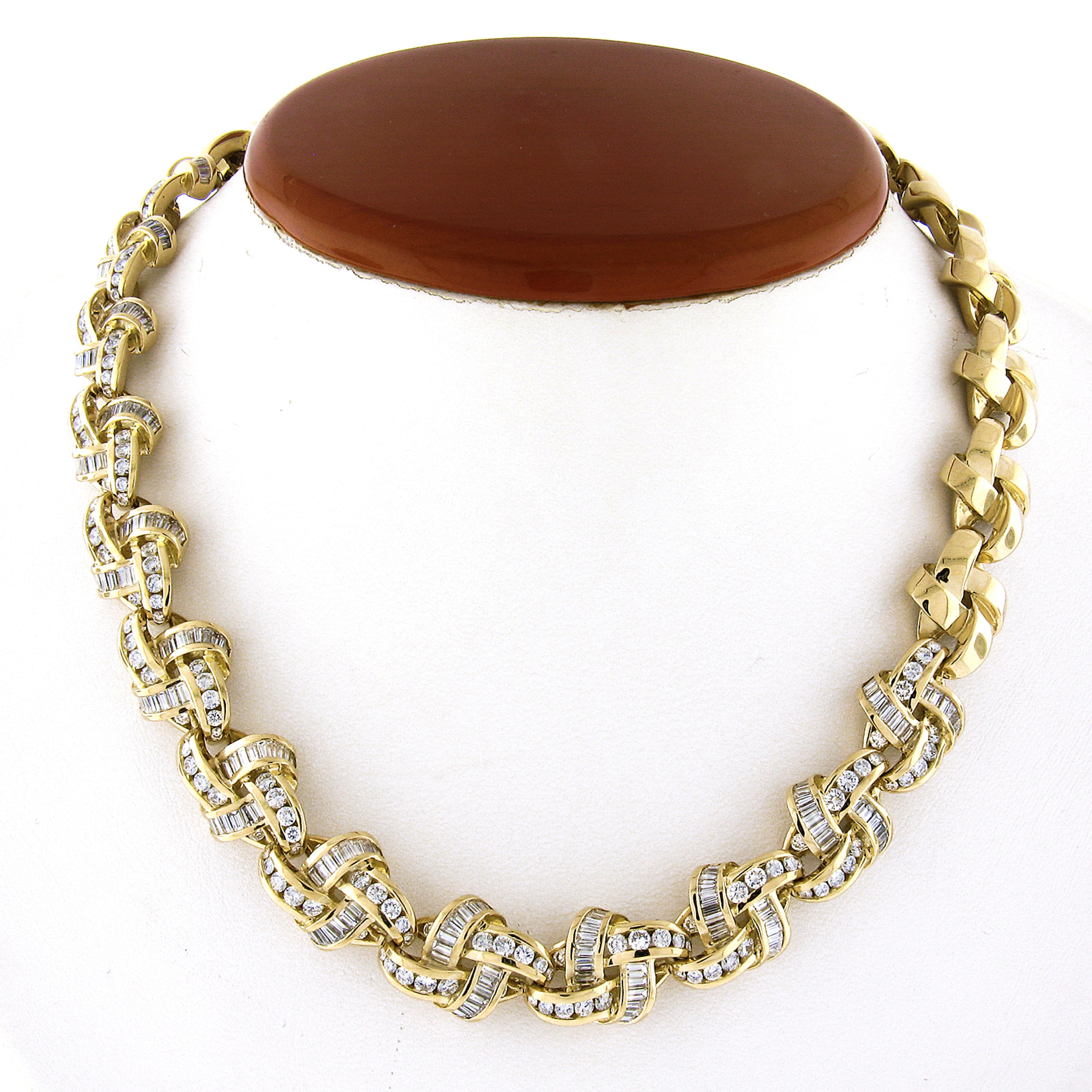 This Charles Krypell rare interlocking knot link statement chain necklace is crafted from solid 18k yellow gold. It features approximately 9 to 10 carats of the finest quality baguette & round brilliant cut diamonds that are all channel set in this