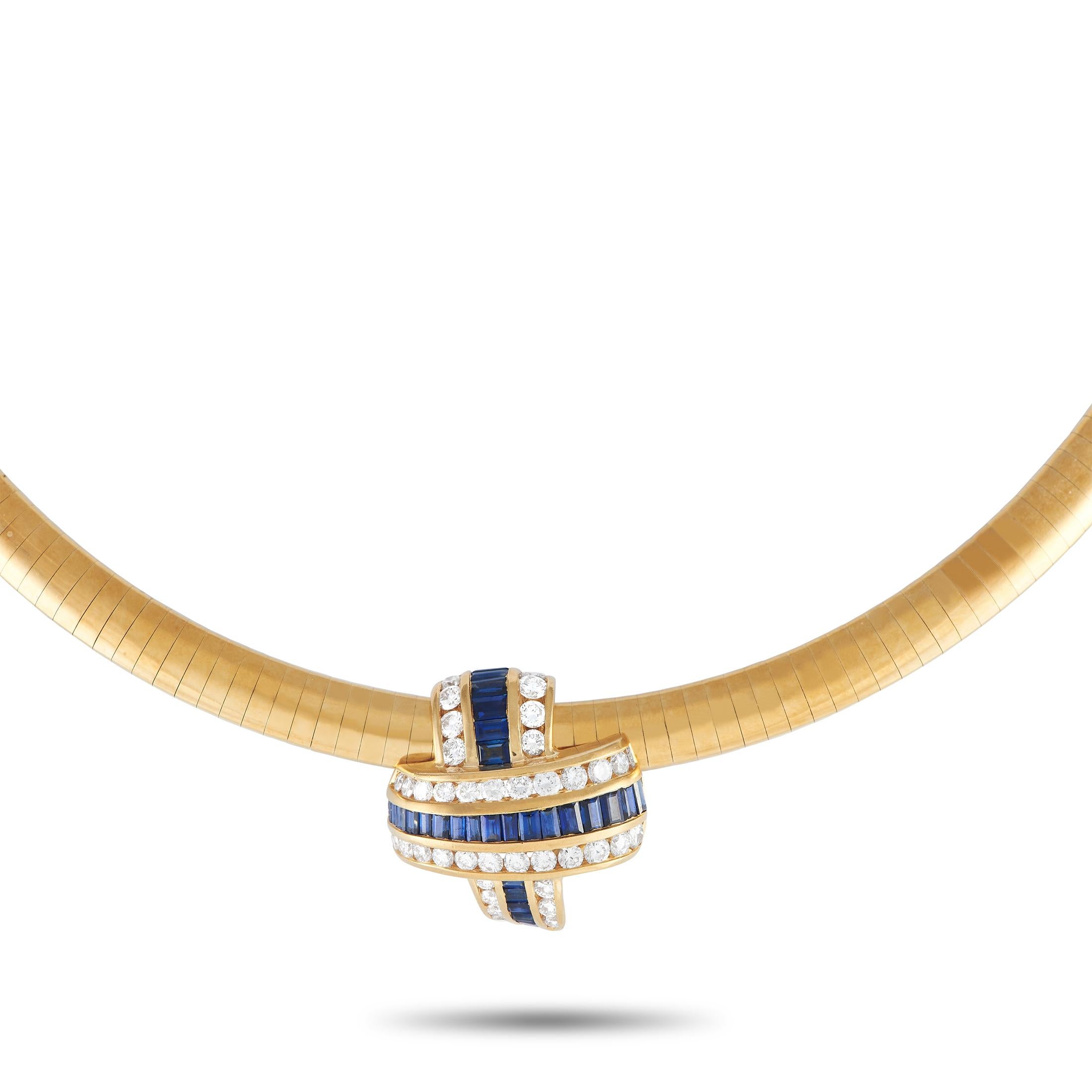 A necklace designed just like a sculpture. This jewel features a beautiful omega chain holding a ribbon-like slider pendant embellished with rows of baguette-cut sapphires and white diamonds. The slide pendant measures approximately 0.75-inch in