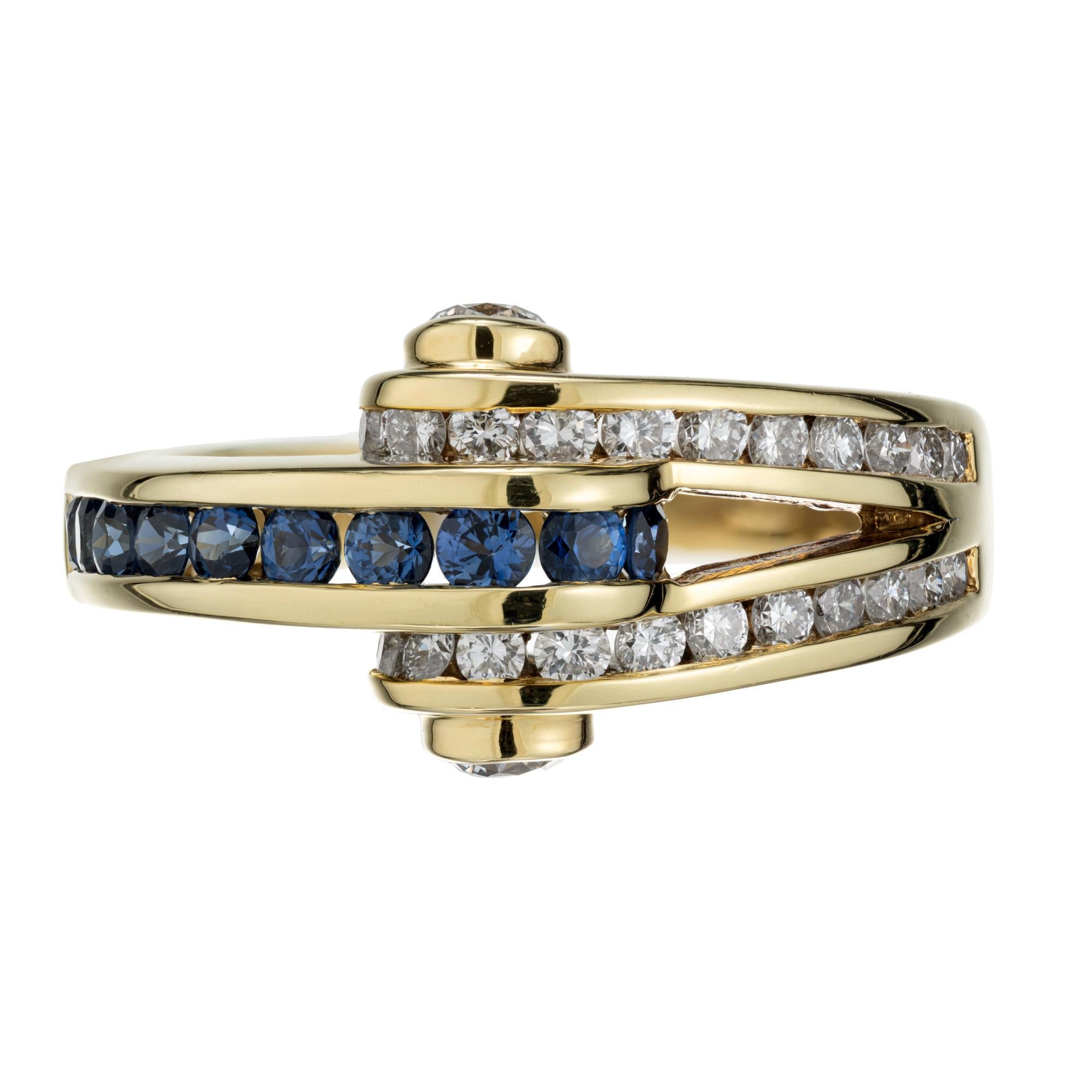 Authentic Charles Krypell sapphire and diamond ring. 10 round cut sapphires and 26 full cut diamonds set in 18k yellow gold split shank band ring. 

10 round fine blue Sapphires approx. total weight .30cts
26 full round cut diamonds approx. total