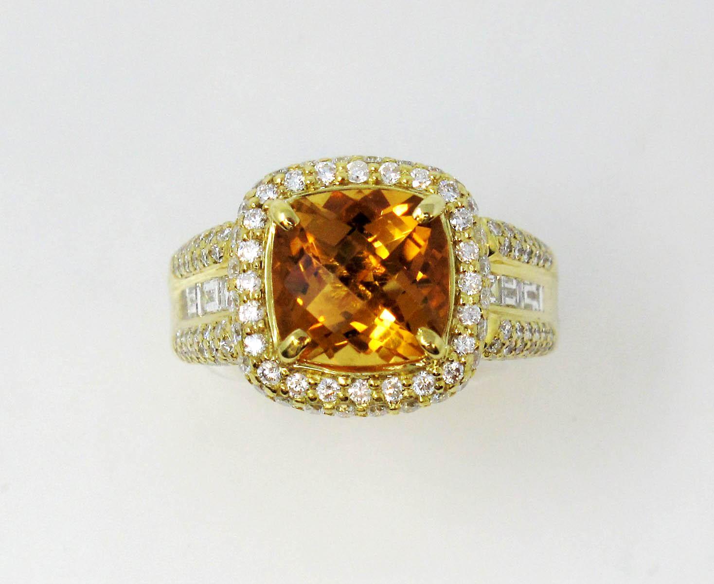 Ring size 7.5

Breathtaking citrine and diamond halo cocktail ring designed by Charles Krypell. This bold yet feminine ring will absolutely radiate on the finger. The striking orange cushion cut center stone is paired with a glittering halo of