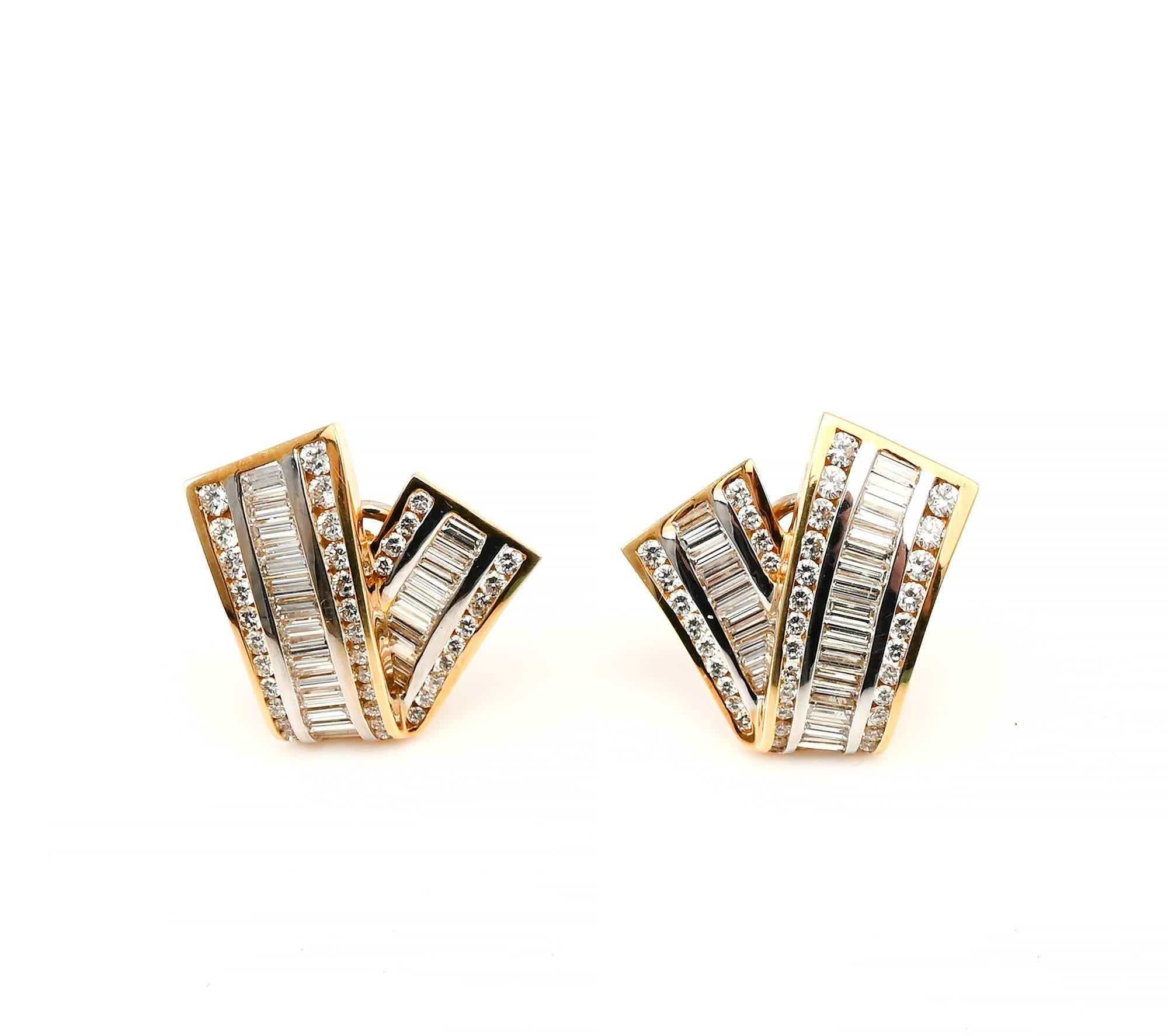 Elegant V shape diamond earrings by Charles Krypell. The uneven  and slightly curved arms of the V give these earrings added elegance and a touch of whimsey. The earrings have 126 full cut diamonds. They are set in 18 karat yellow gold. Backs are