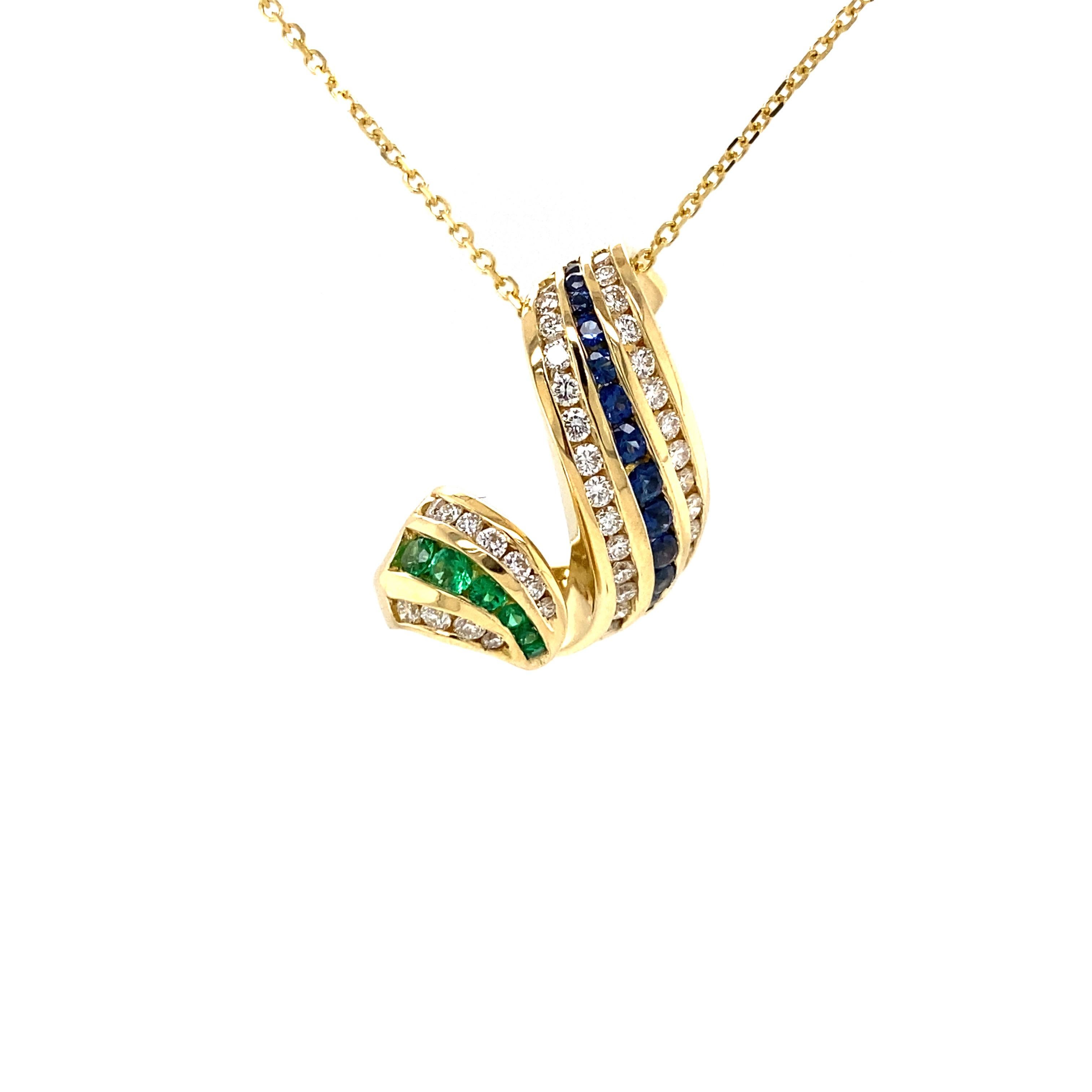 Charles Krypell Diamond Emerald Sapphire Swirl Pendant in 18K Yellow Gold.  (6) Emerald Gemstones weighing 0.18 carat total weight, (14) Sapphires weighing 0.30 carat total weight and (45) Round Brilliant Cut Diamonds weighing 0.78 carat total