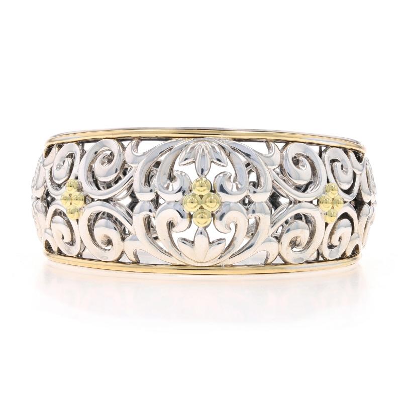 Retail Price: $2290

Brand: Charles Krypell
Collection: Ivy

Metal Content: Sterling Silver, 18k Yellow Gold, & 14k Yellow Gold

Style: Cuff
Fastening Type: Hinge (opens & slides over wrist)
Theme: Botanical Scroll
Features: Tapered Silhouette with