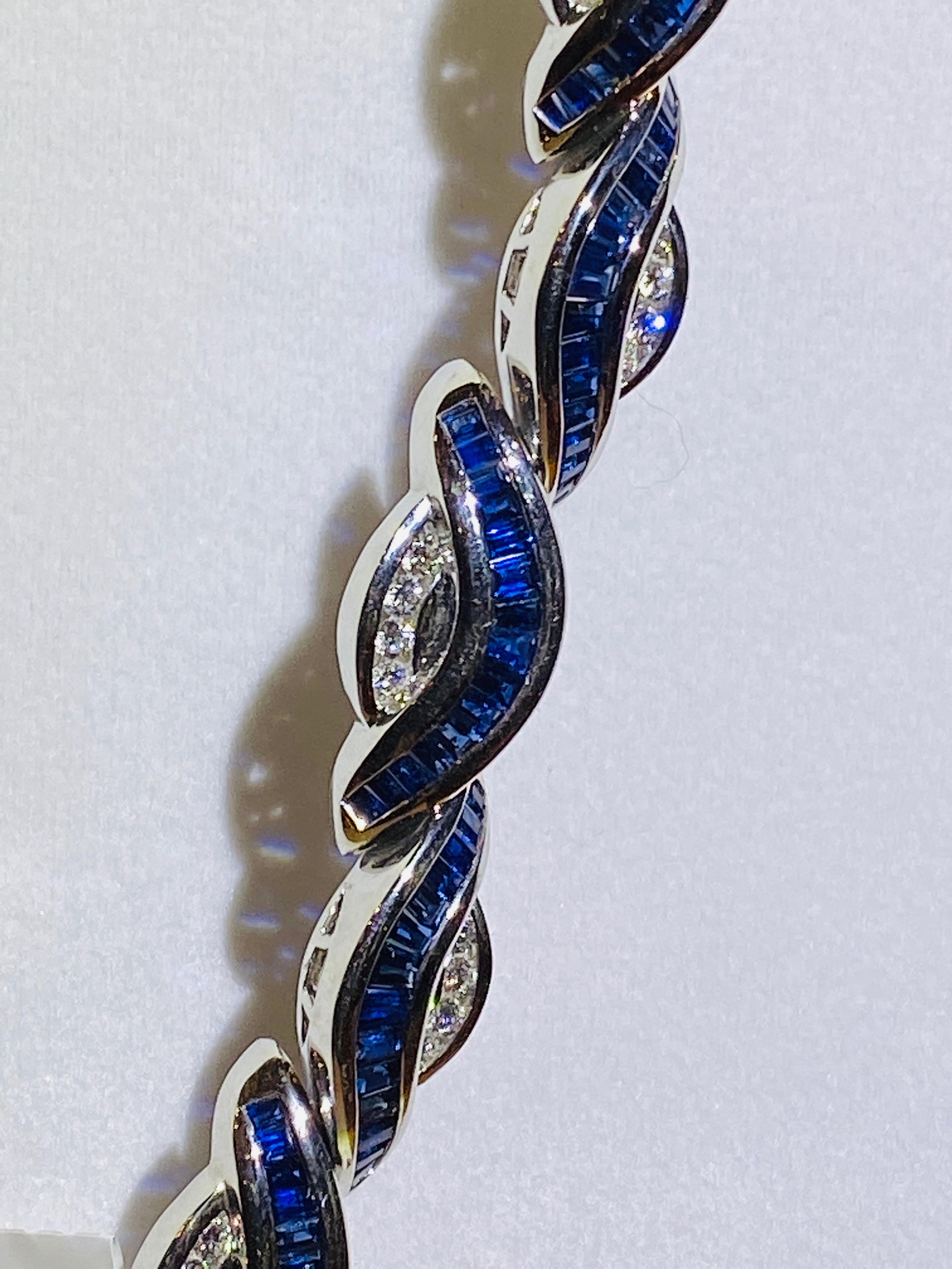 Platinum sapphire and diamond bracelet containing 148 baguette sapphires weighing combined 10.09 carats and 40 round brilliant cut diamond weighing combined 1.44 carats. 