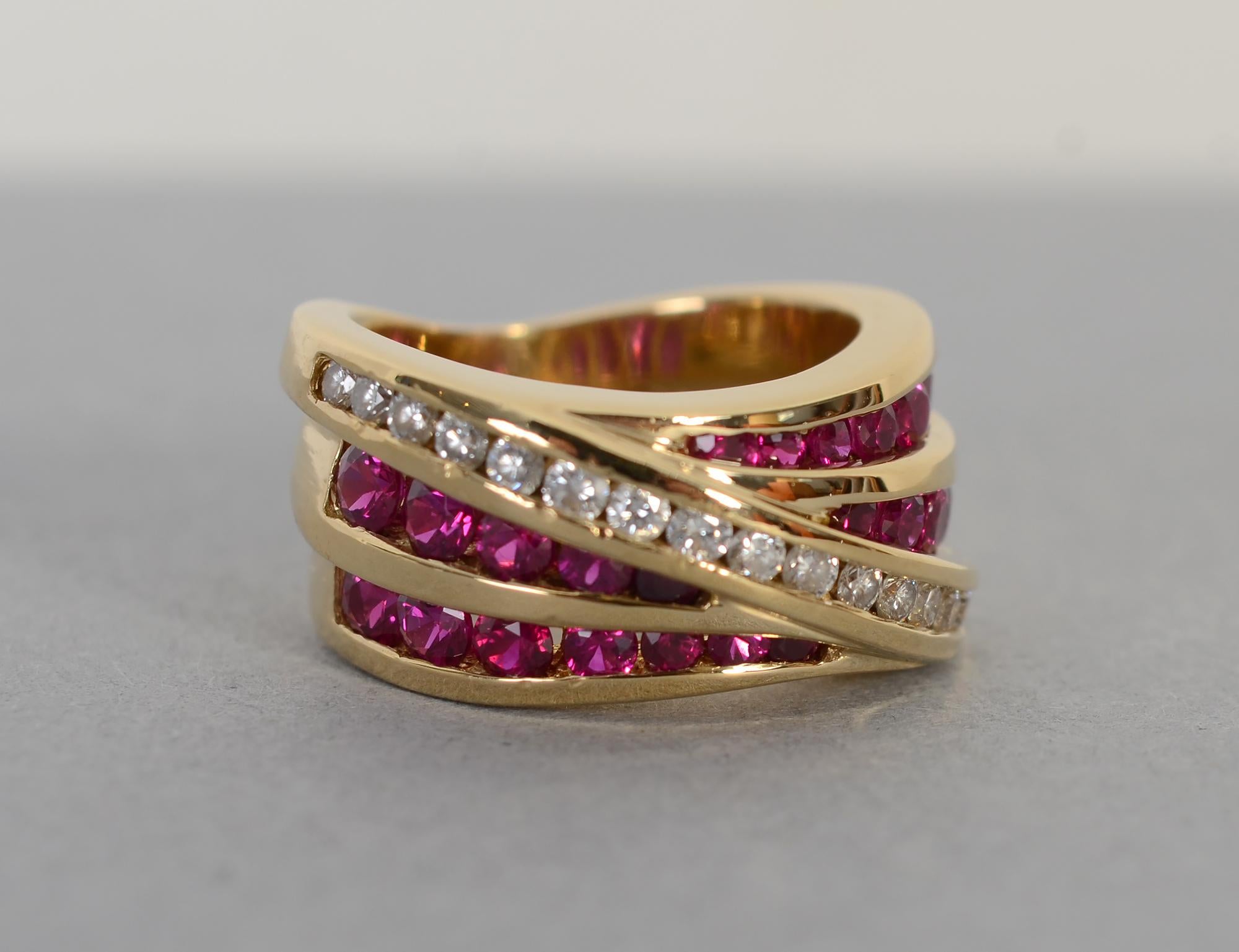 Beautiful ring by Charles Krypell  with two rows of rubies over which is a diagonal band of 17 diamonds. The ring is intentionally uneven in height as part of the three dimensional almost fabric-like design. It is 7/16