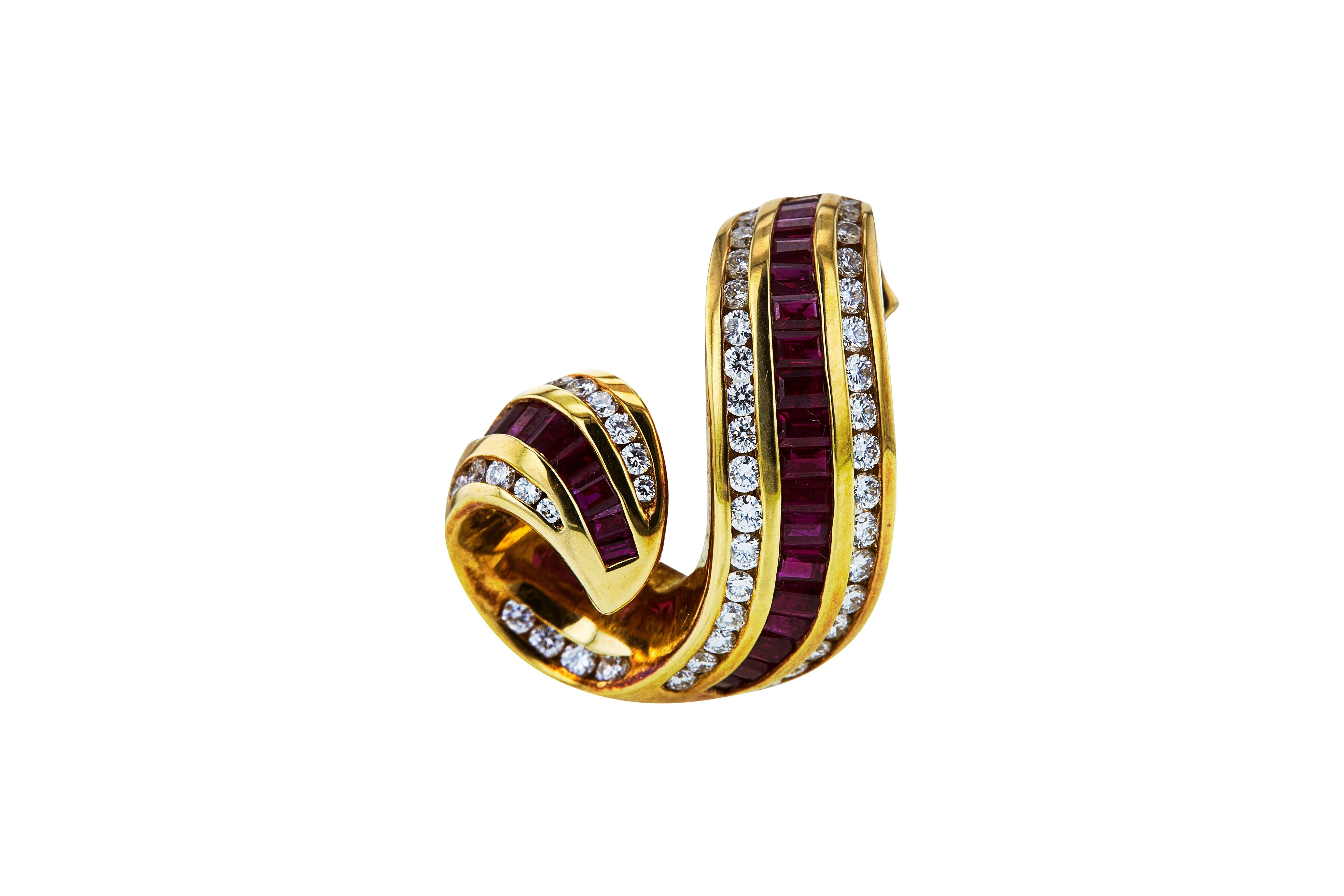 Authentic Charles Krypell free-form slide crafted in 18 karat yellow gold set with ruby baguettes and round brilliant cut diamonds (G/H, VS) weighing approximately 0.79 carats. The pendant measures 1 x ¾ inches and weighs 11.5 grams. Signed Krypell,