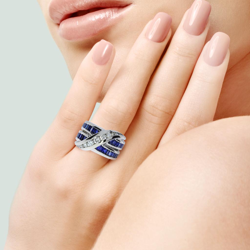 From designer Charles Krypell this significant calibrated cut sapphires and diamond ring is just stunning set in platinum.

Hallmarks: PT950, KRYPELL

Total Diamonds: 13
Total Carat Weight: 0.67 ctw
Diamond Shape: Round Brilliant
Diamond Clarity: