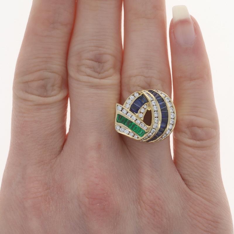 Size: 6 1/2

Brand: Charles Krypell

Metal Content: 18k Yellow Gold

Stone Information

Natural Sapphires
Treatment: Heating
Carat(s): 1.53ctw
Cut: Baguette
Color: Blue

Natural Emeralds
Treatment: Oiling
Carat(s): .68ctw
Cut: Baguette
Color: