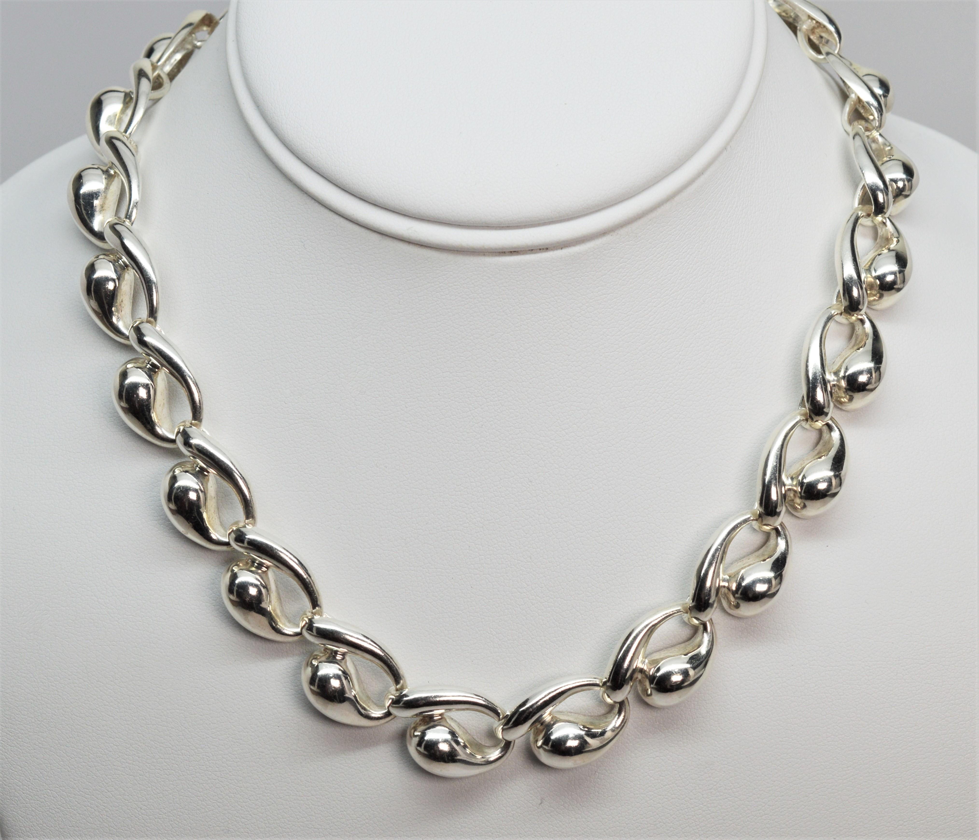 Vintage Charles Krypell signed sculptured sterling silver link seventeen inch statement necklace. Unique and stylish with tear drop inspired links in high luster sterling silver. 
Measures approximately 1/2 inch wide and 3/8 inch deep. Has easy