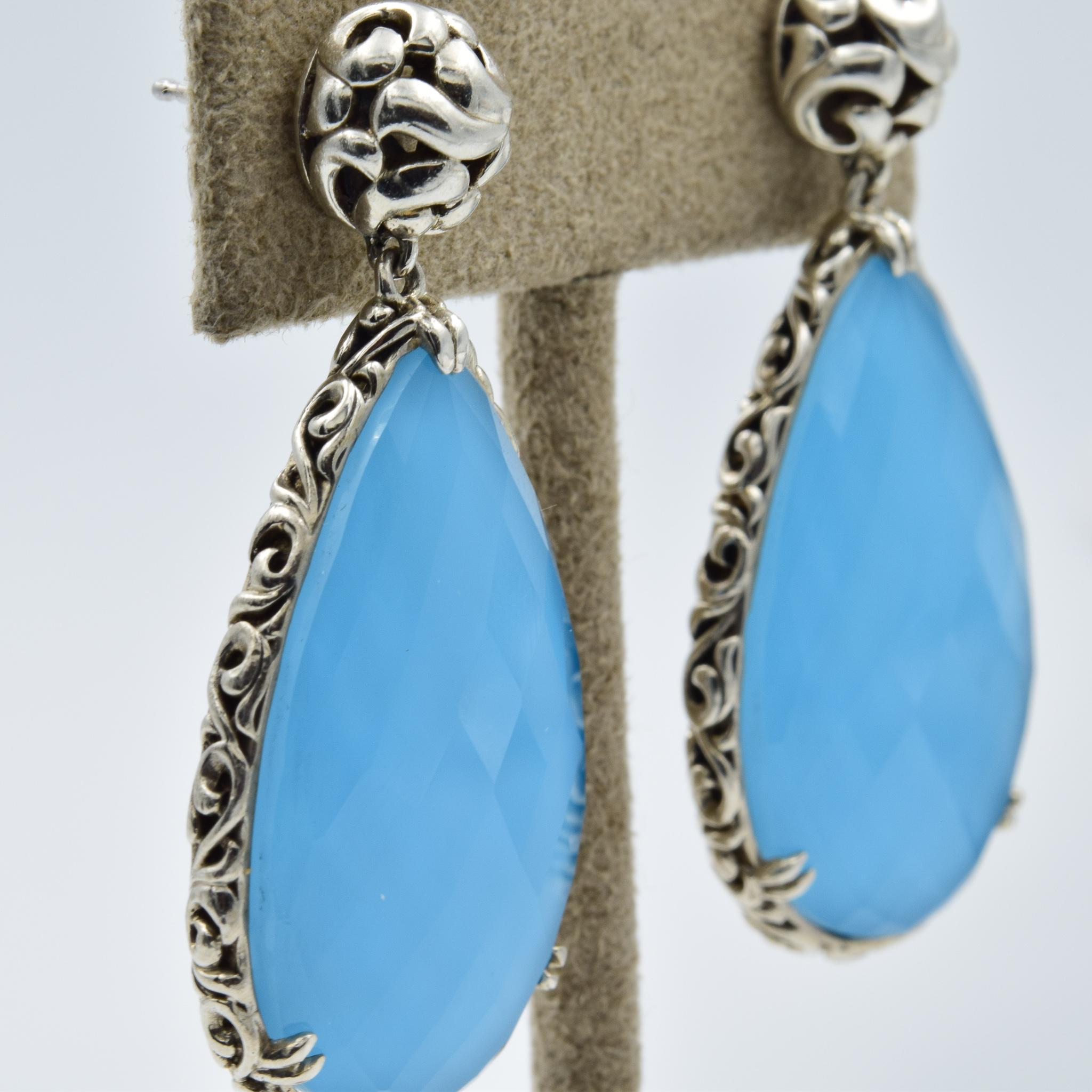 These Charles Krypell earrings are beautiful and in fantastic condition.  They were just traded in to the store.  The turquoise has a quartz crystal overlay which gives a unique pattern on the stone in the lighting.  

Dimensions: 
Width: 23