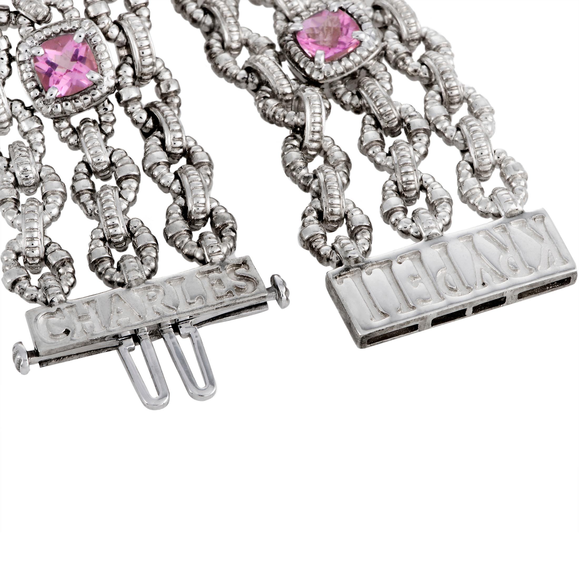This Charles Krypell bracelet is crafted from 14K white gold and silver and decorated with pink tourmalines. The bracelet weighs 64 grams and measures 7.50” in length.

Offered in brand new condition, this jewelry piece includes a gift box.