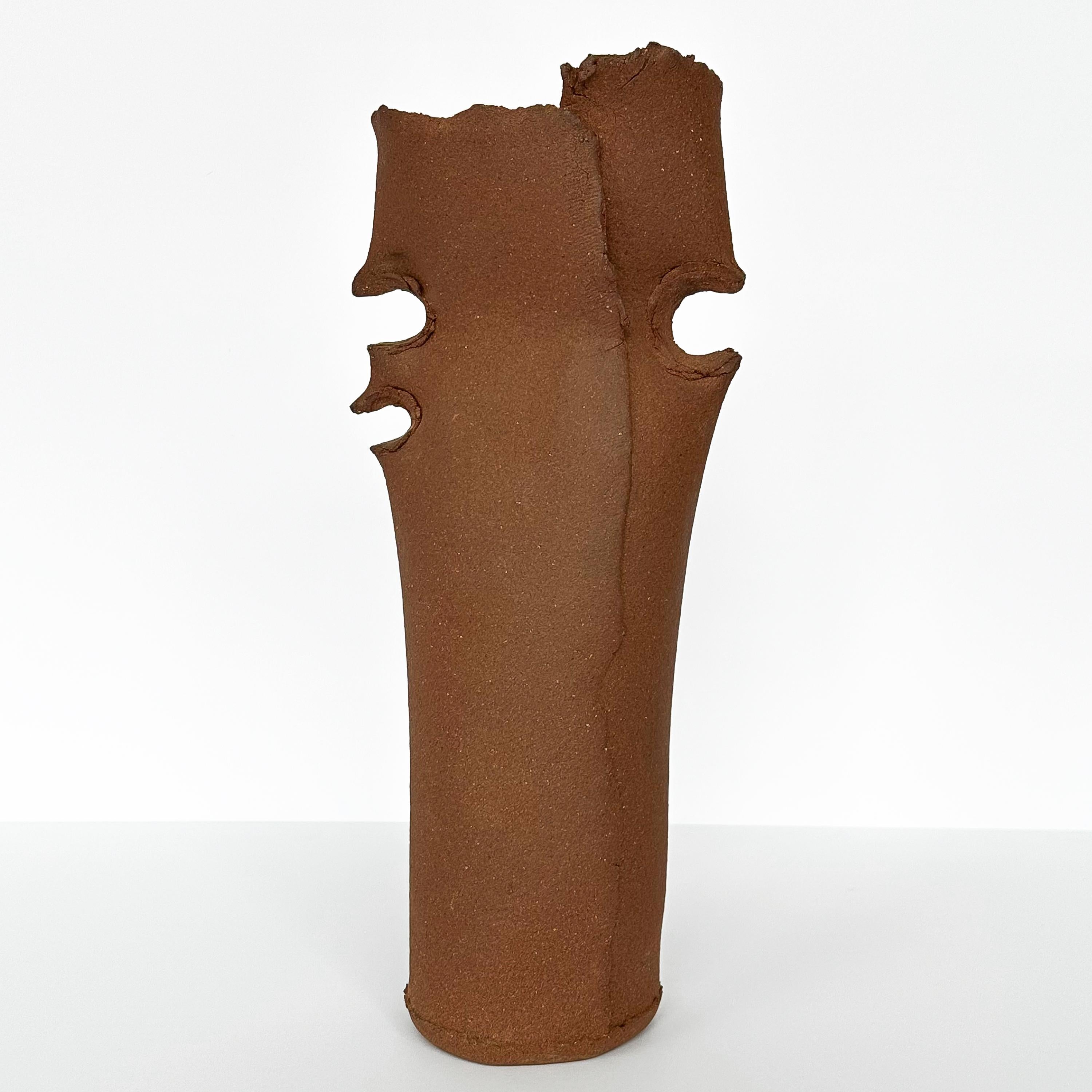 A Charles Lakofsky (1922-1993) unglazed stoneware studio pottery vase, circa 1970s. This Brutalist styled slab-built stoneware vase features a pinched design on both sides and a raw edge at the vase opening. Beautiful terracotta brown color. Signed