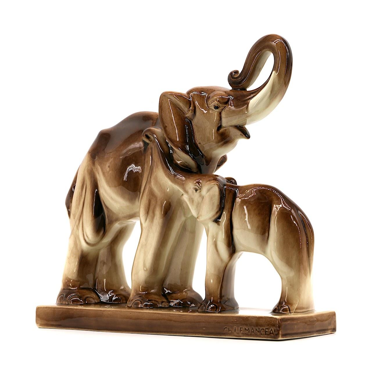 Couple of Elephants by Charles Lemanceau at Saint-Clement's, France, 1920s. A beautiful example of French art ceramics, this pair of elephants by Charles Lemanceau was produced at the Saint-Clement's factory around 1935. The sculpture depicts a