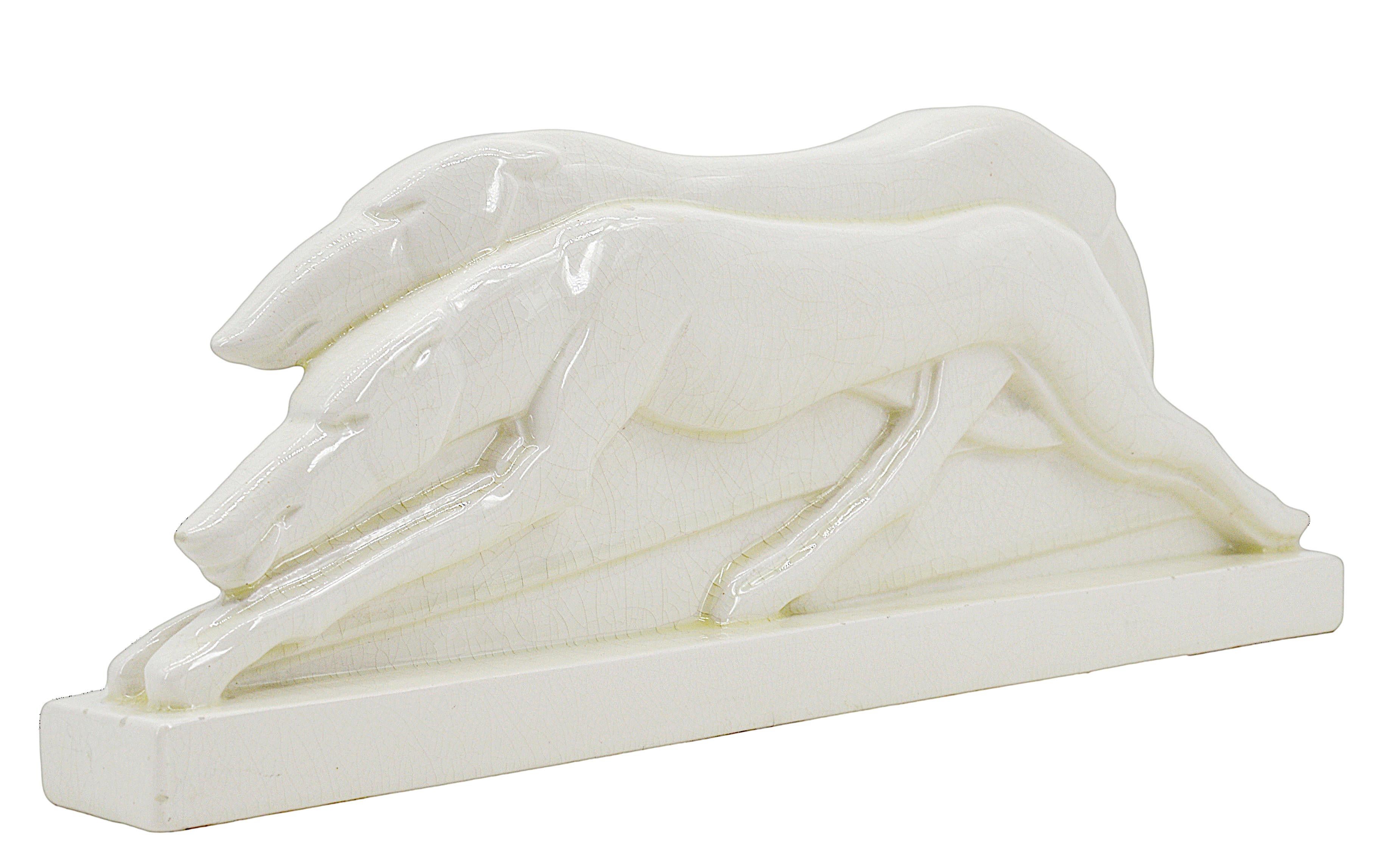 French Art Deco greyhound couple sculpture by Charles LEMANCEAU at Saint-Clément, France, 1930. Greyhound race. This piece was illustrated in the Saint-Clément catalogue, 1930 and sold in Le Bon Marché (Parisian department store). Also illustrated