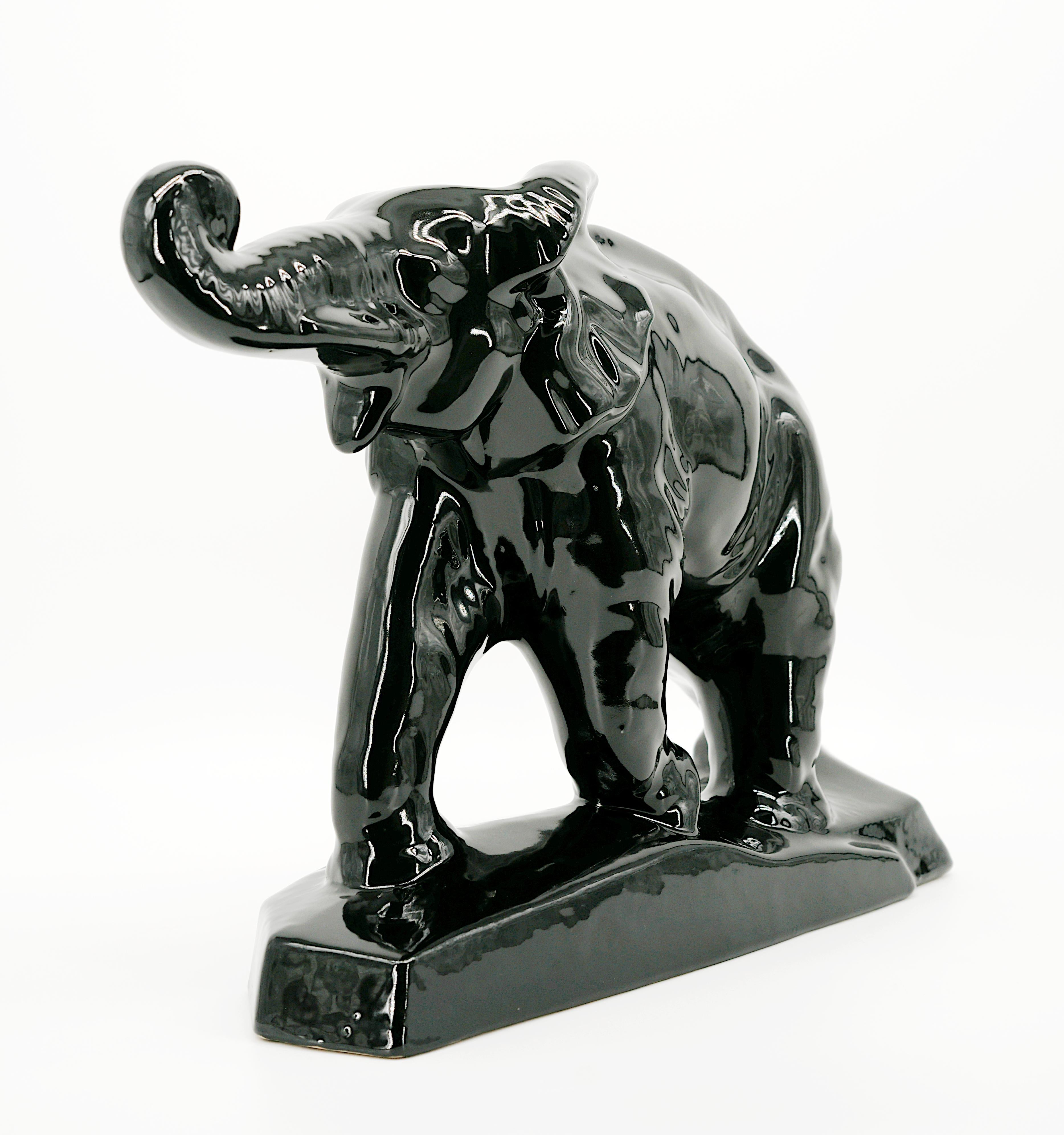 French Art Deco glazed black ceramic elephant statue by Charles LEMANCEAU at Saint-Clement, France, 1930s. Width: 17.1