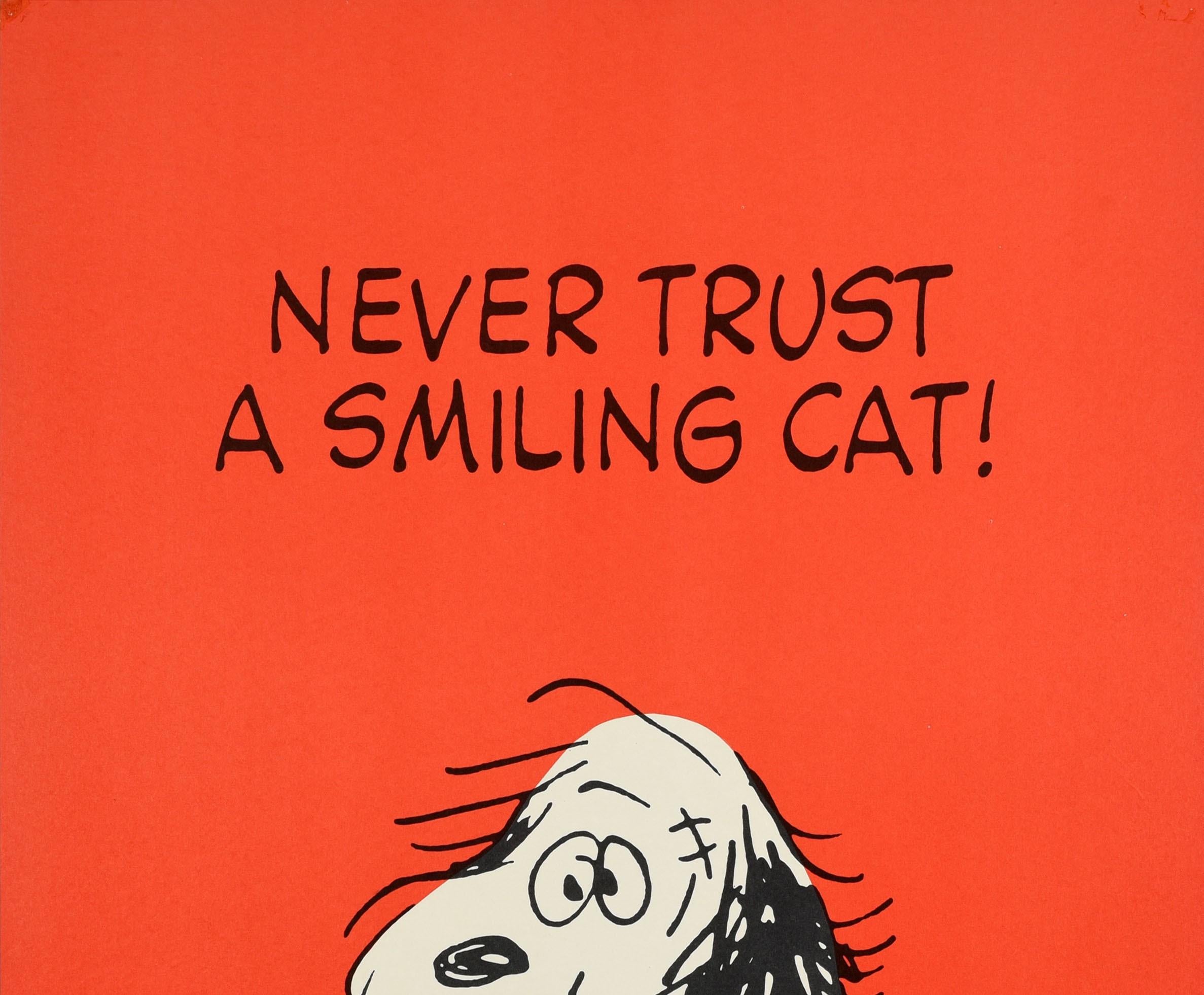 Original Vintage Poster Never Trust A Smiling Cat Snoopy Dog Quote Cartoon Art - Print by Charles M. Schulz