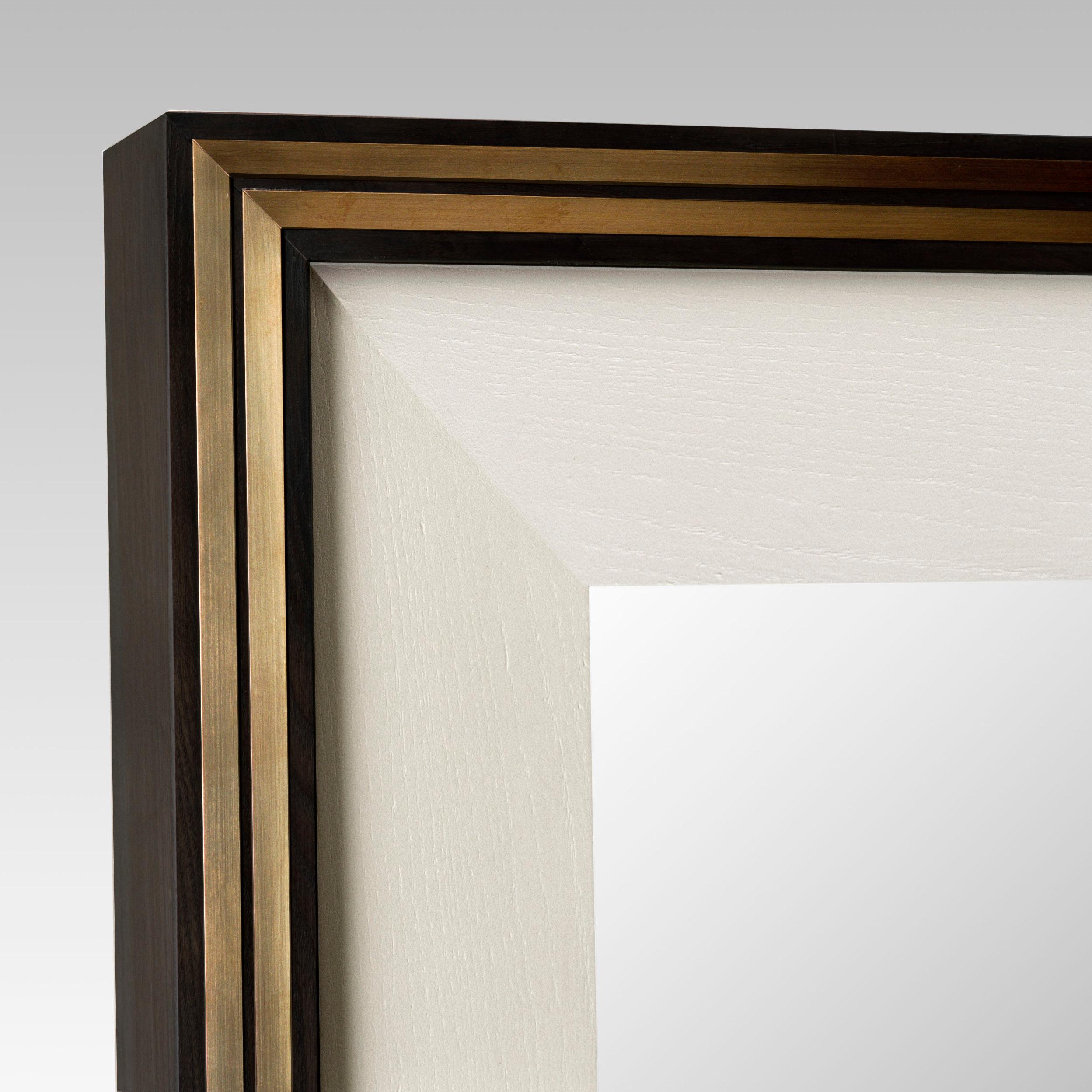 Black (RAL 9004) satin lacquered wood frame mirror with brass trim and white (RAL 9001) satin lacquered inner frame finish. 

Small: W85 x H135 x D8 cm

Regular: W140 x H220 x D8 cm

Lead time: 10 - 14 weeks

Currently in stock in the following