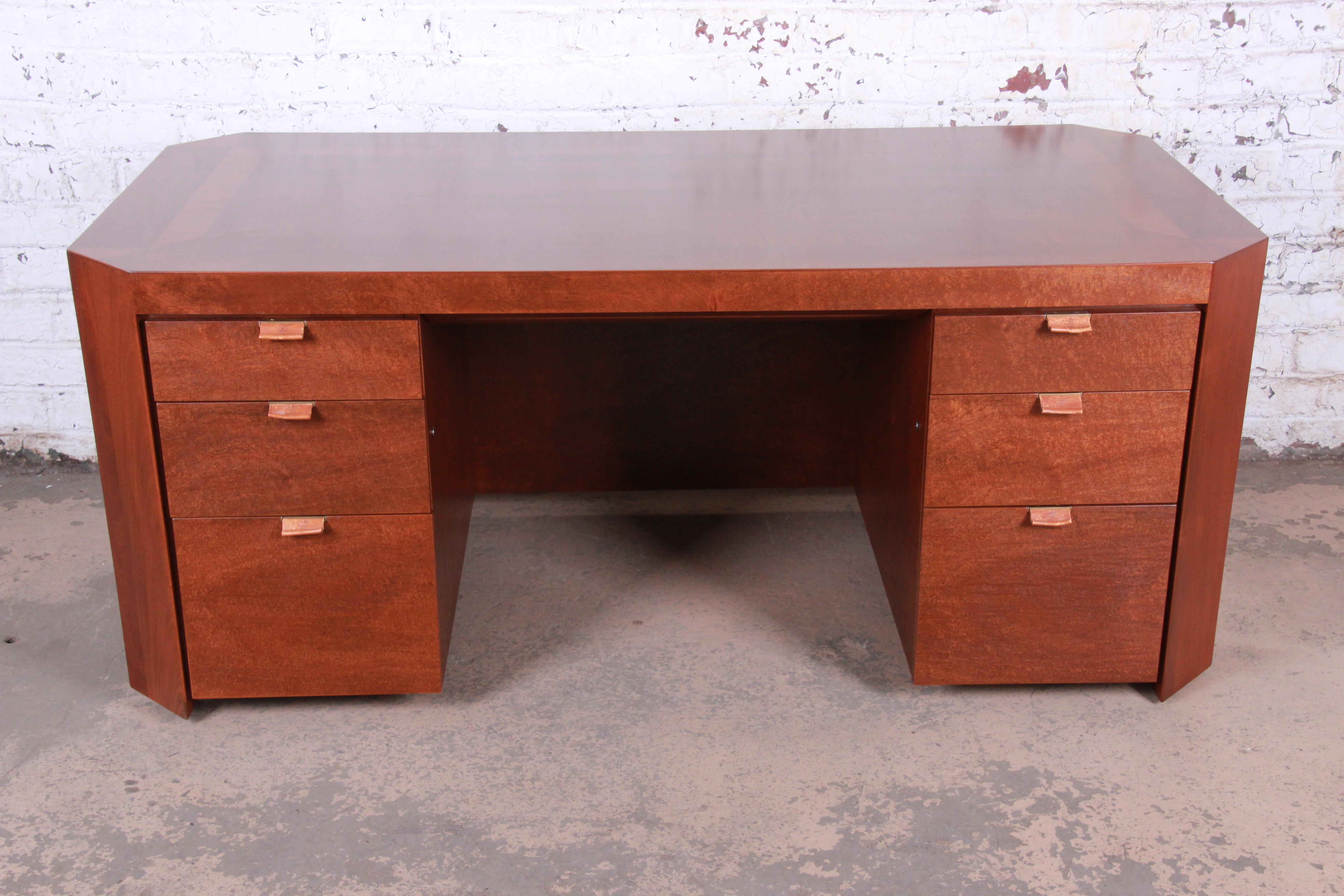 An extremely rare and exceptional Art Deco executive desk

By Charles Pfister for Baker Furniture

USA, 1980s

Primavera wood with parquetry inlay top and embossed leather drawer pulls.

Measures: 72