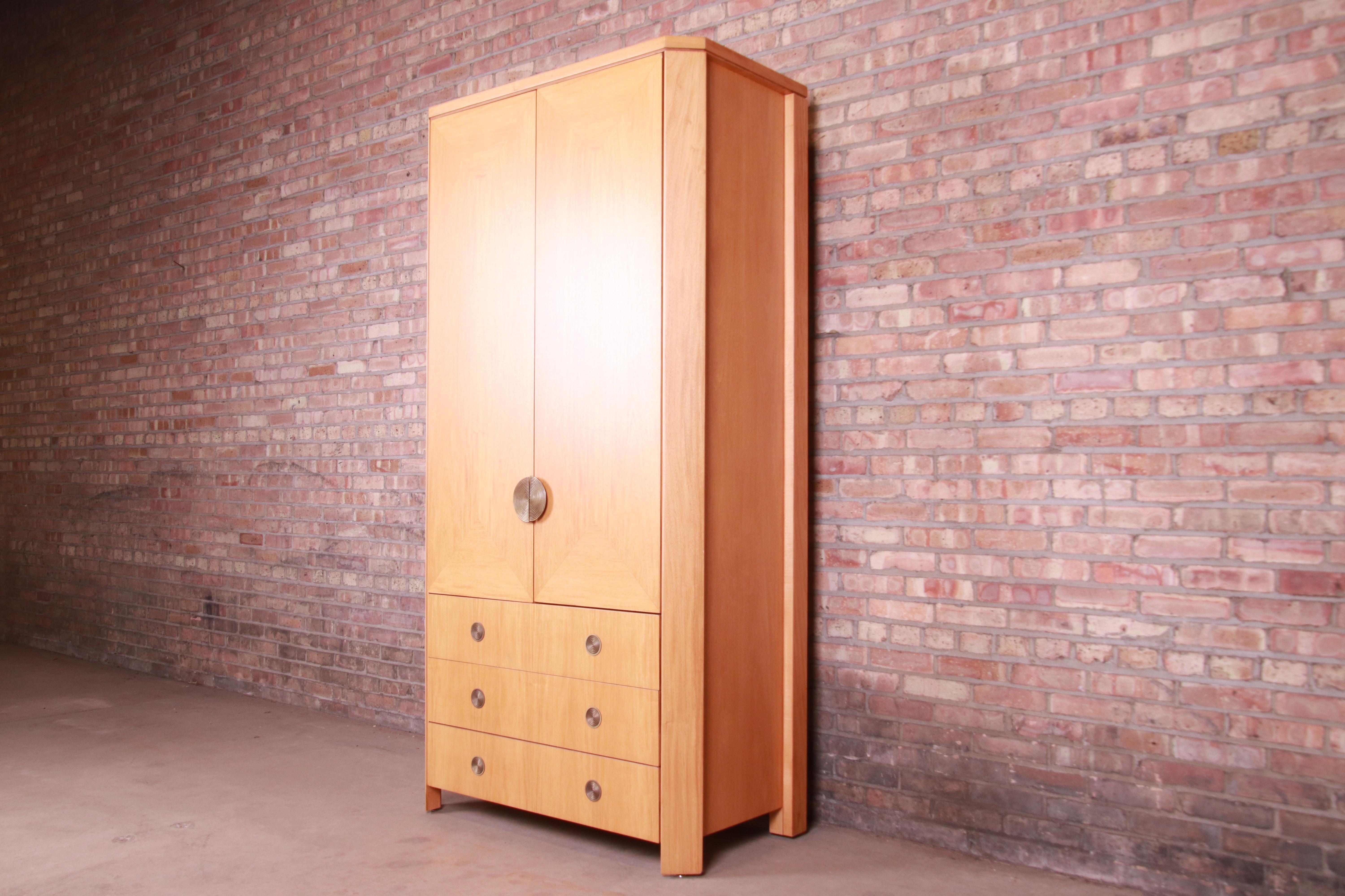 A rare and exceptional modern Art Deco skyscraper armoire or wardrobe dresser.

By Charles Pfister for Baker Furniture.

USA, 1980s

Primavera wood, with original brass hardware

Measures: 42