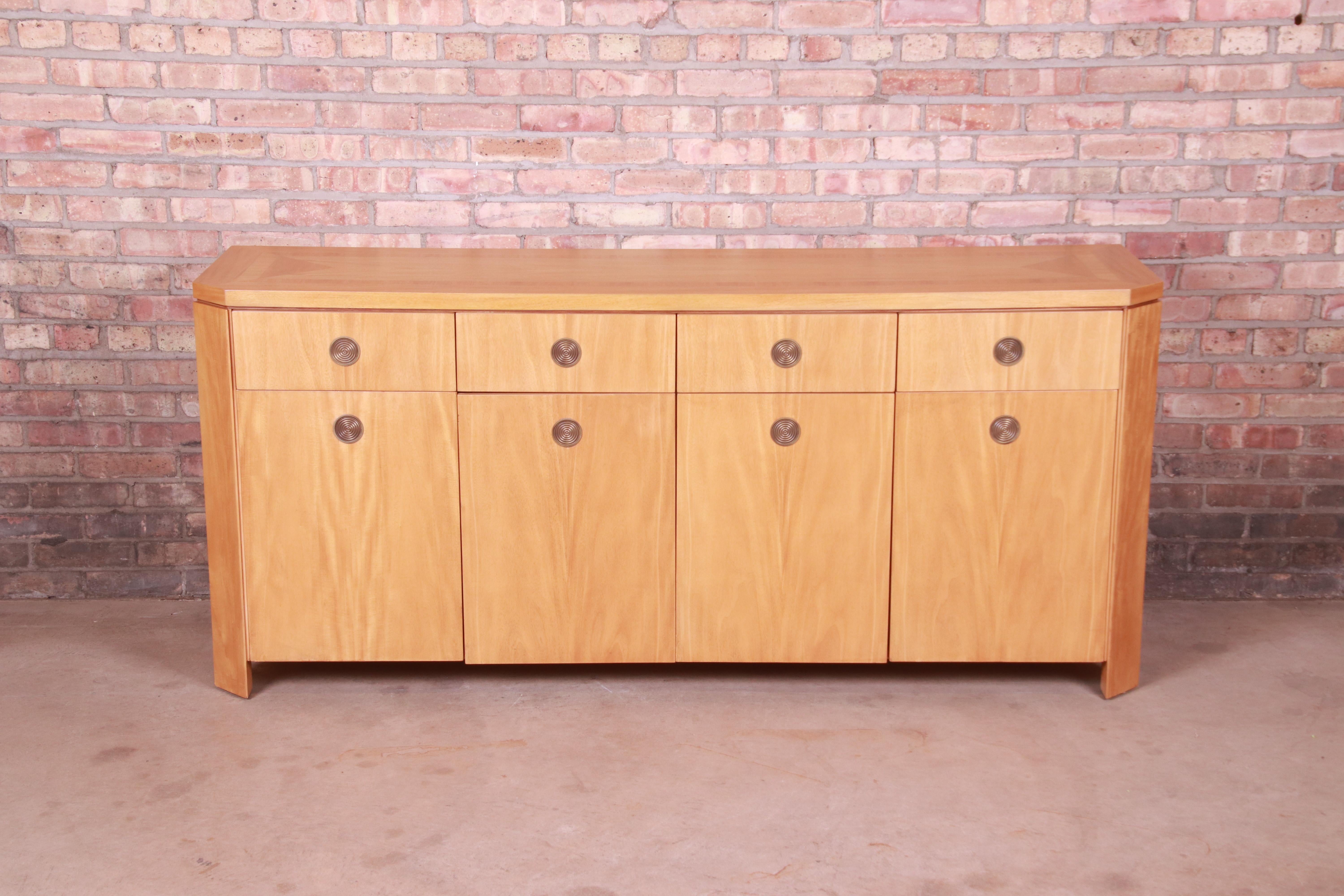 A rare and gorgeous modern Art Deco sideboard, credenza, or bar cabinet

By Charles Pfister for Baker Furniture

USA, 1980s

Primavera (white mahogany) wood, with parquetry inlay and concentric brass pulls.

Measures: 72