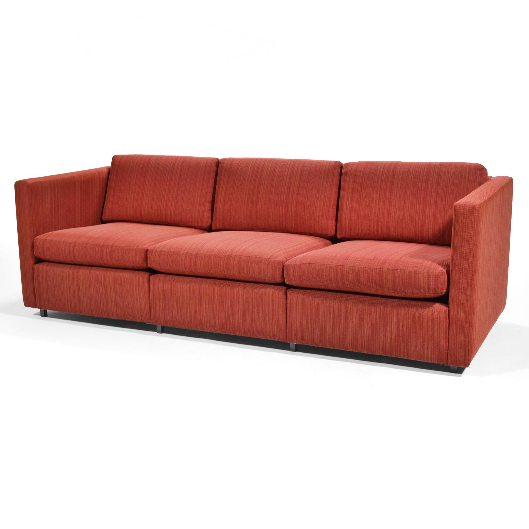 Pfister's clean-lined design is a subtle, understated design that works beautifully in almost any interior. We particularly love how the small, inset legs give the sofa a floating quality. This example is upholstered in a nicely textured brick red