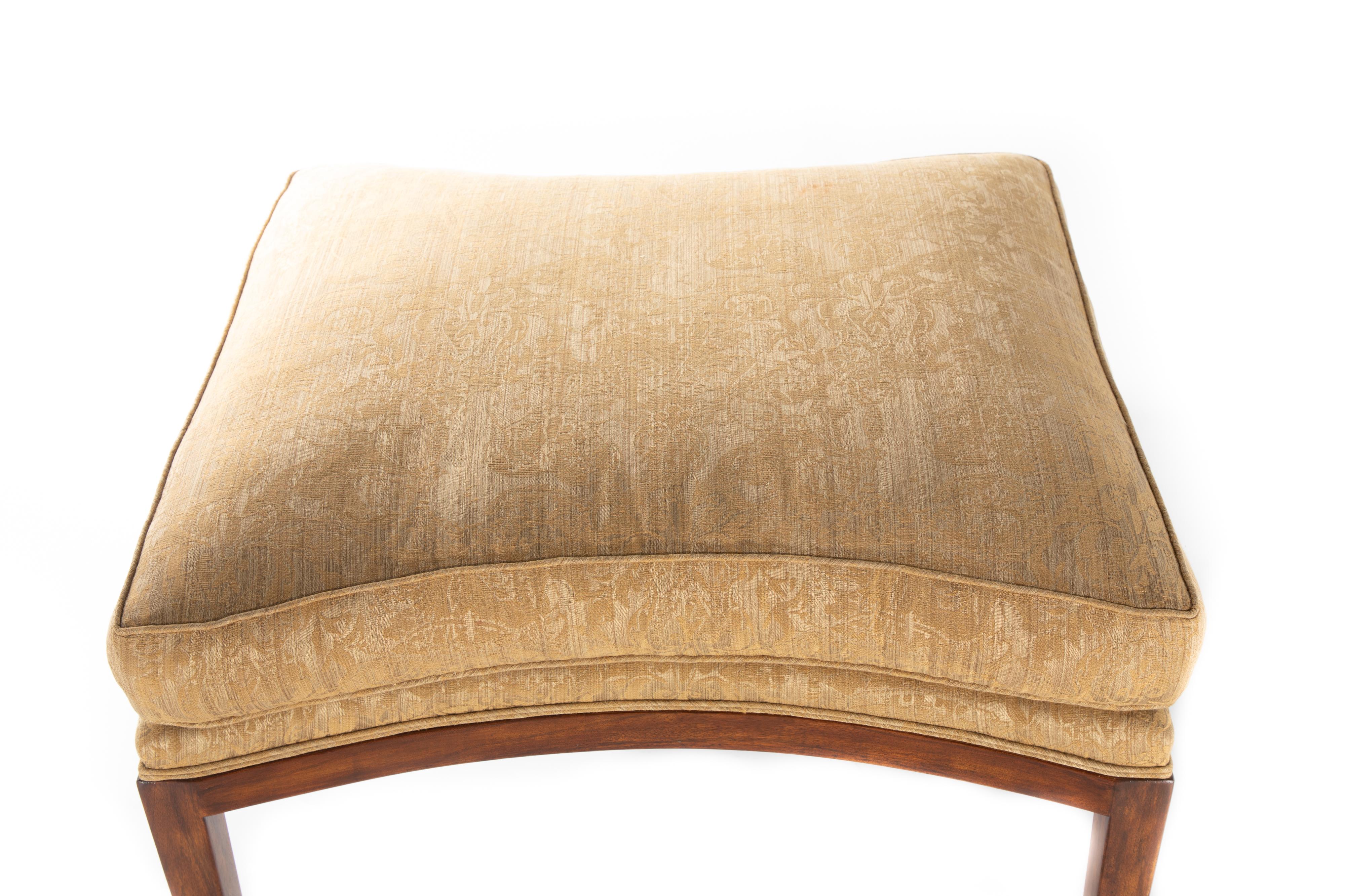 Custom ottoman by Charles Pollack with semi attached boxed seat cushion covered in Bergamo fabric.