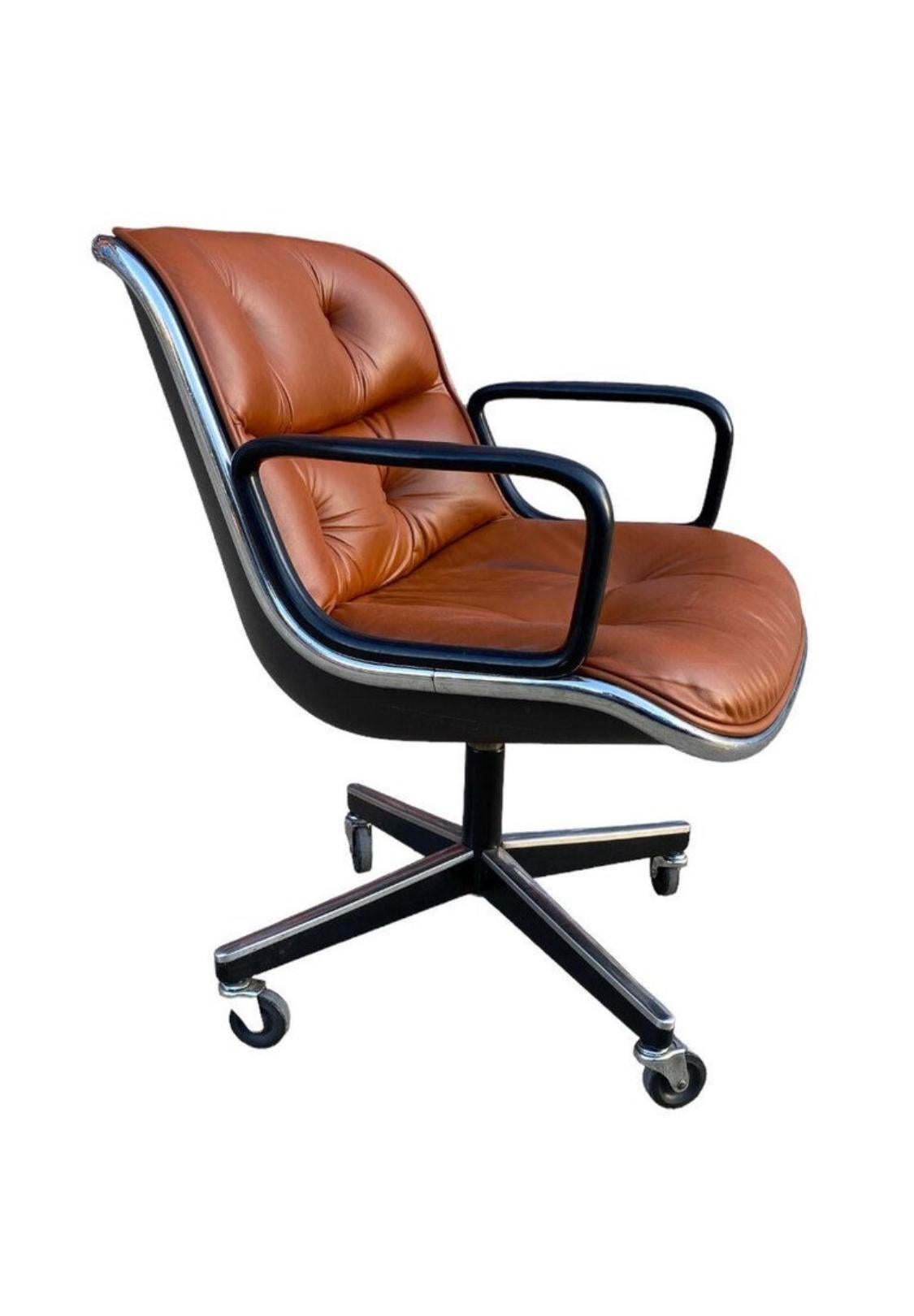 Vintage Charles Pollock for Knoll executive chair in burnt orange leather. This executive desk chair has a tilt and swivel base with adjustable height. Base with all wheels in working condition. Good vintage condition, wear consistent with age and