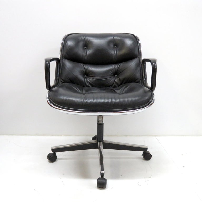 wonderful executive armchairs designed by Charles Pollock for Knoll in 1956, black leather upholstery with black arms on a four star stainless steel swivel/tilt control base with casters, labeled, priced individually.
