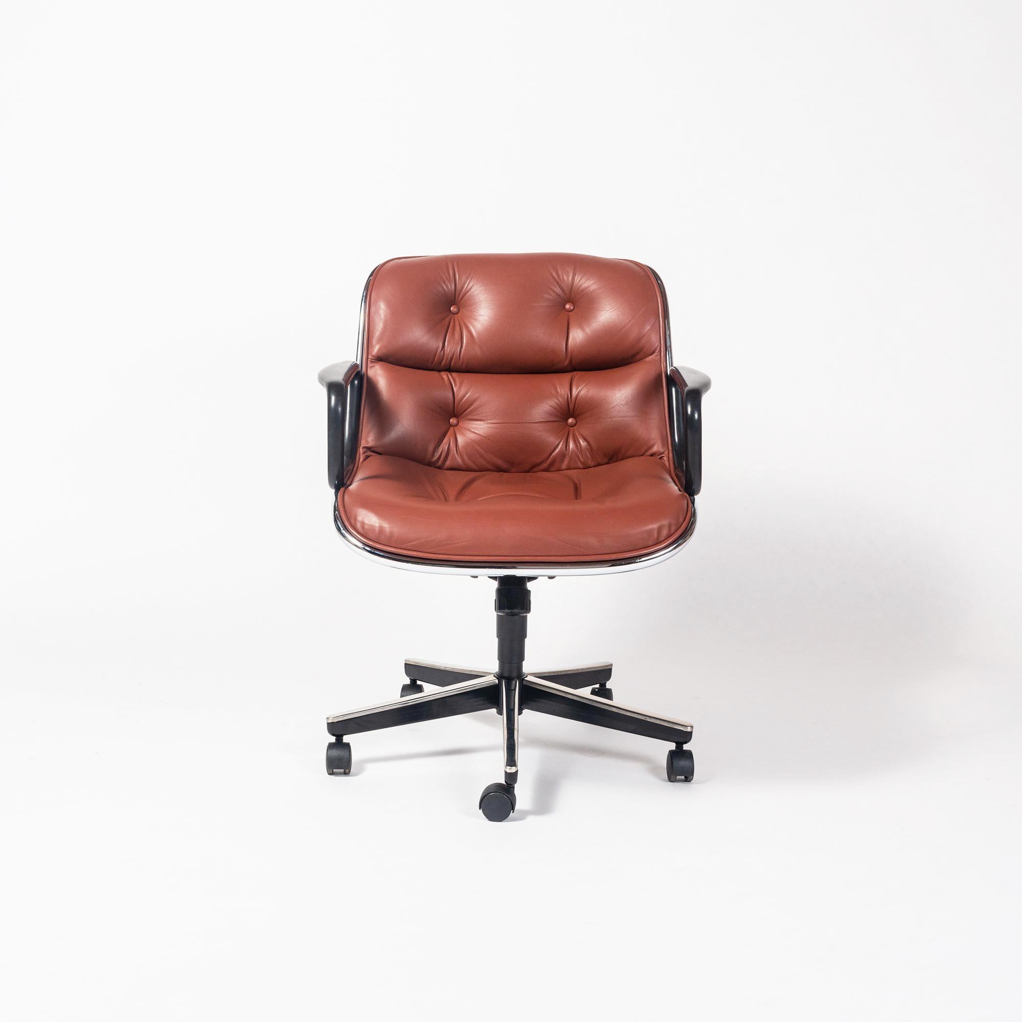 Designed in 1963 and have been in constant production since, this Charles Pollock for Knoll mid century wheeled office desk chair with black wheel base, hard casters and upgraded Sabrina leather in Pumpkin color is in pristine condition. The leather