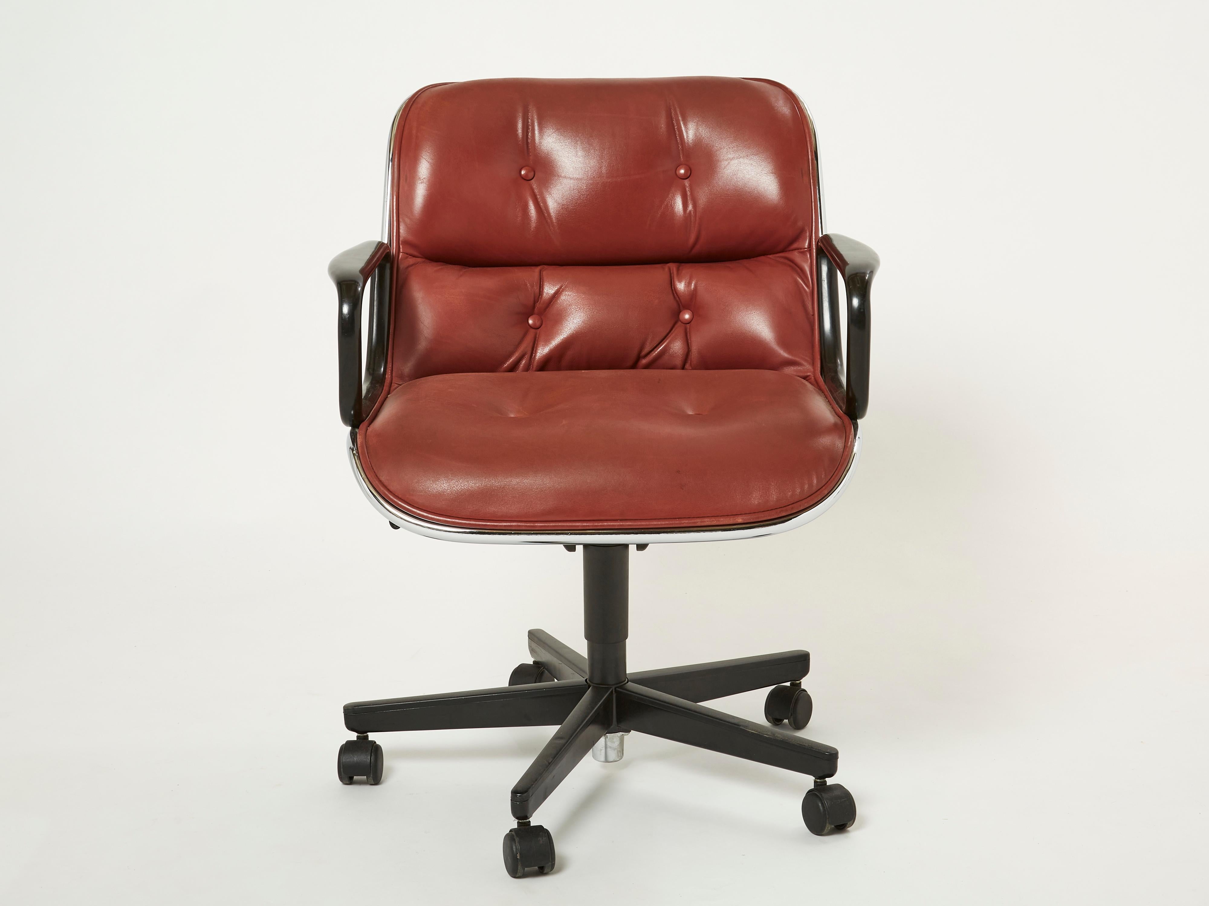 Beautiful Executive armchair by Charles Pollock for Knoll from the 1990s. This office chair features a cognac brown leather seat and back with button detail, chrome shaft, black plastic arms, and a 5 stainless base with black casters. This chair is