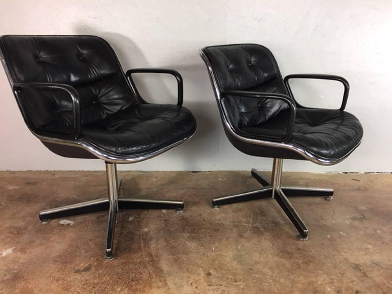 Pair of Charles Pollock executive swivel chairs in black leather on a four star base for Knoll. Adjustable. Very good overall condition. No rips, tears, holes or unusual wear. 

 