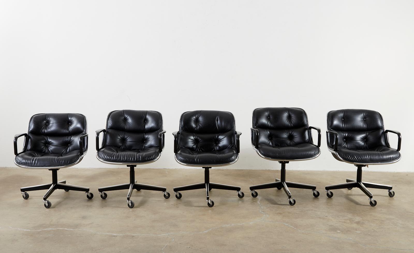 Set of fifteen. matching executive office desk armchairs designed by Charles Pollock for Knoll in 1963. The chairs feature a tufted black supple leather upholstery and a tilt-swivel movement of 360 degrees. The chairs adjust from 31-36 inches high