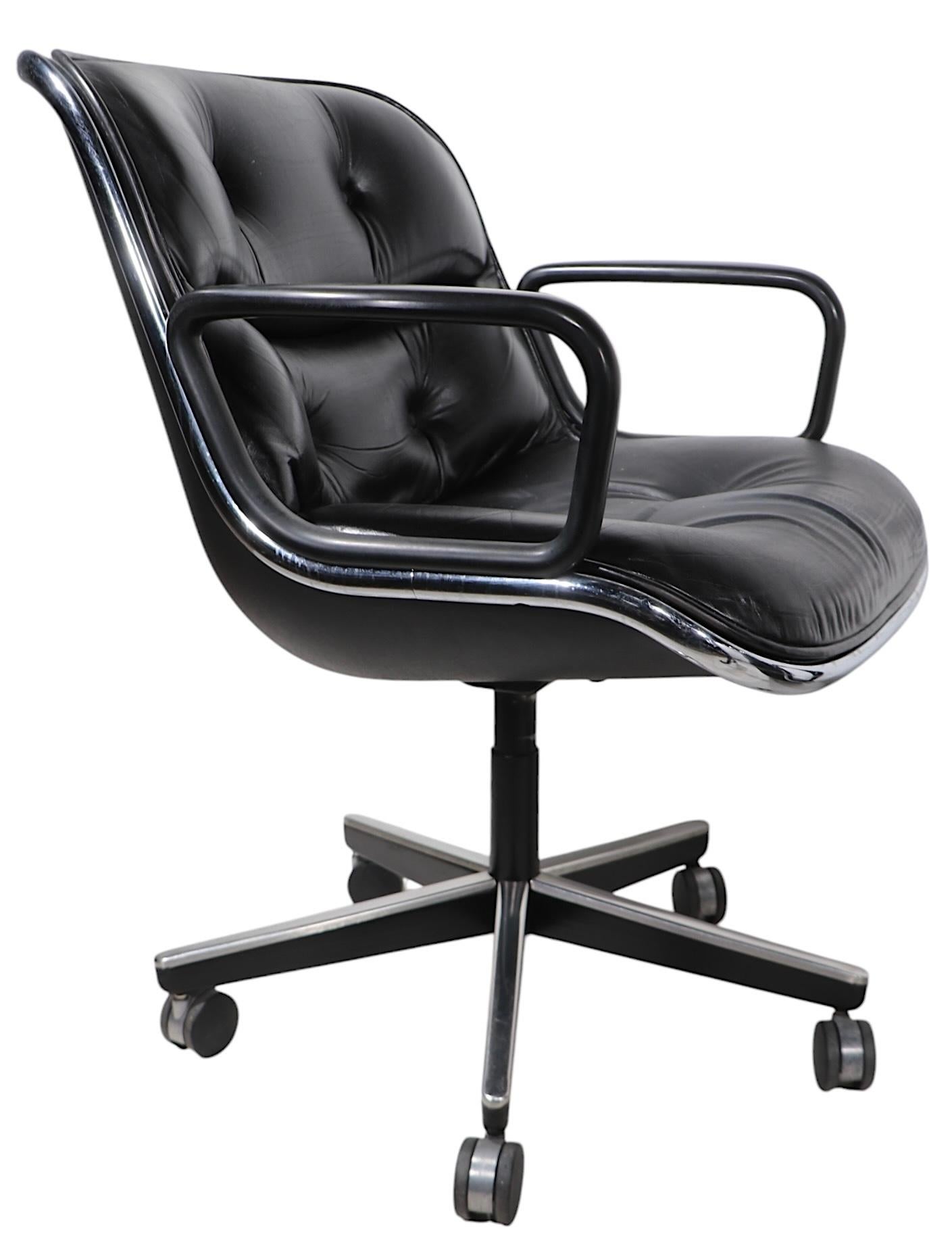Sharp modern design classic, designed by Charles Pollock for Knoll, circa 1980's. Known as the Executive Chair, this iconic example features a tufted black leather seat and back rest, black plastic arms, and  a plastic shell frame with chrome trim.