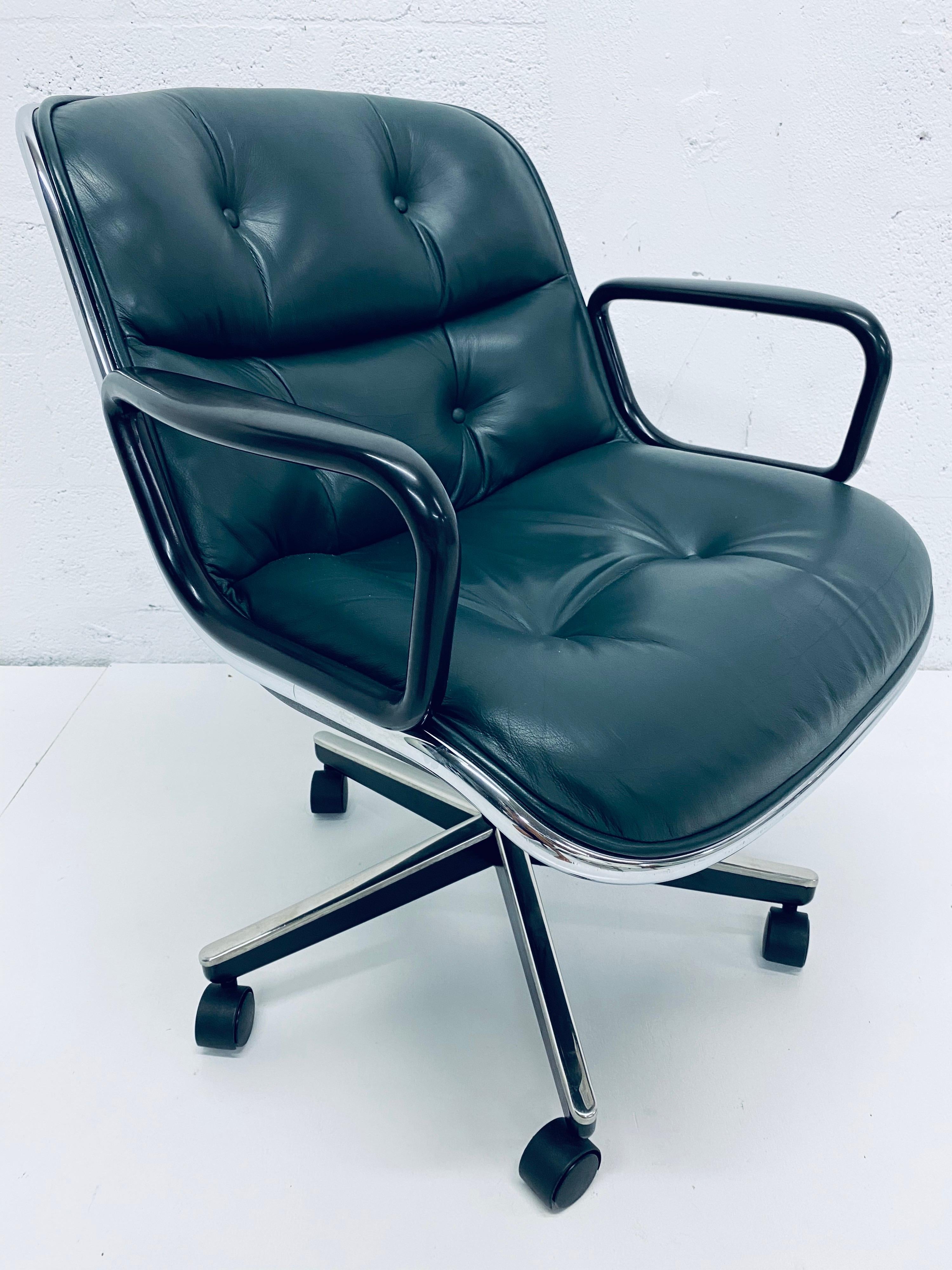 Hunter green leather desk chair on casters by Charles Pollock for Knoll. Seat swivels and tilts and has shock absorbing seat suspension. Not height adjustable. 

 