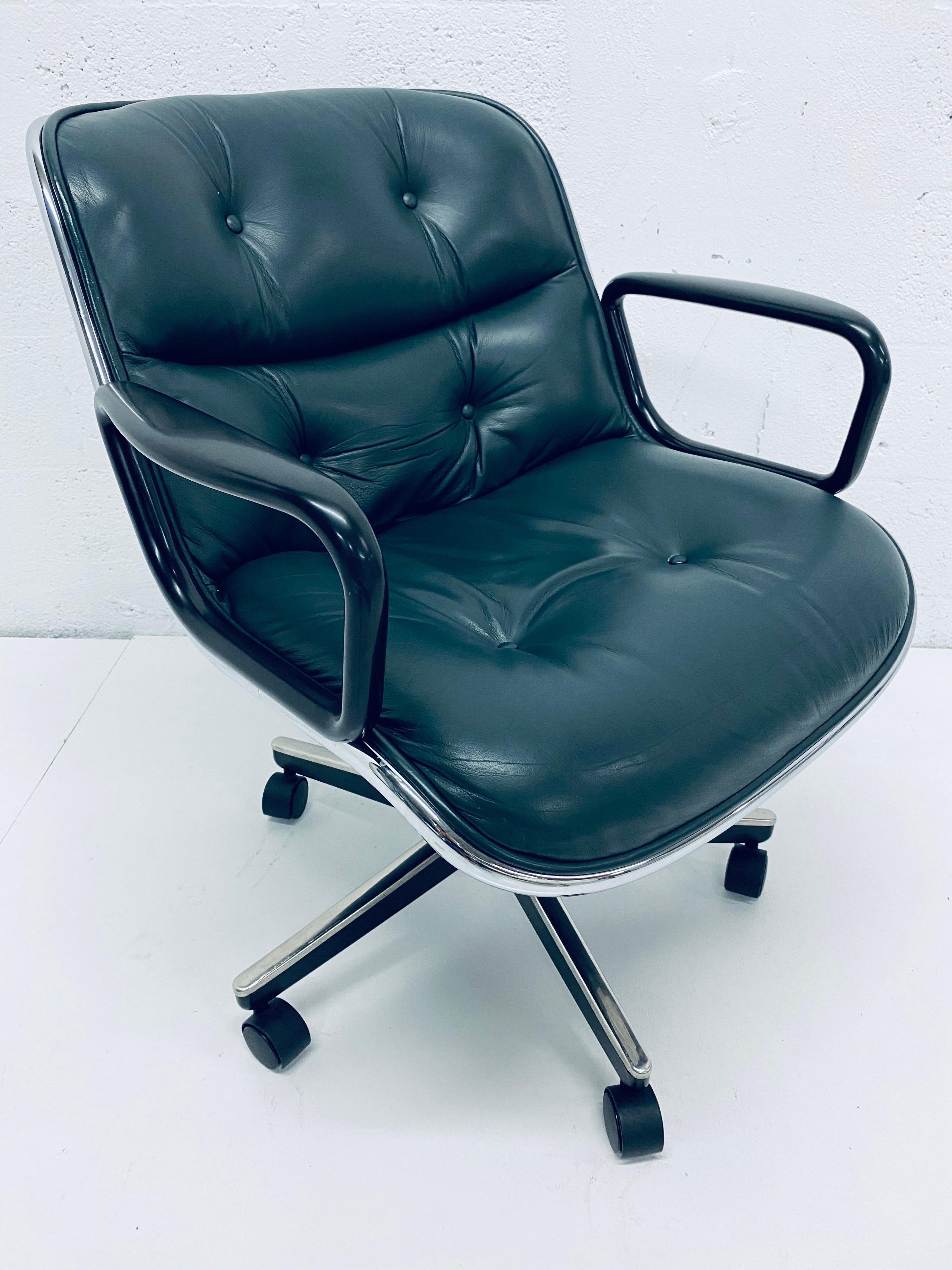Hunter green leather desk chair on casters by Charles Pollock for Knoll. Seat swivels and tilts and has shock absorbing seat suspension. Not height adjustable. 

 