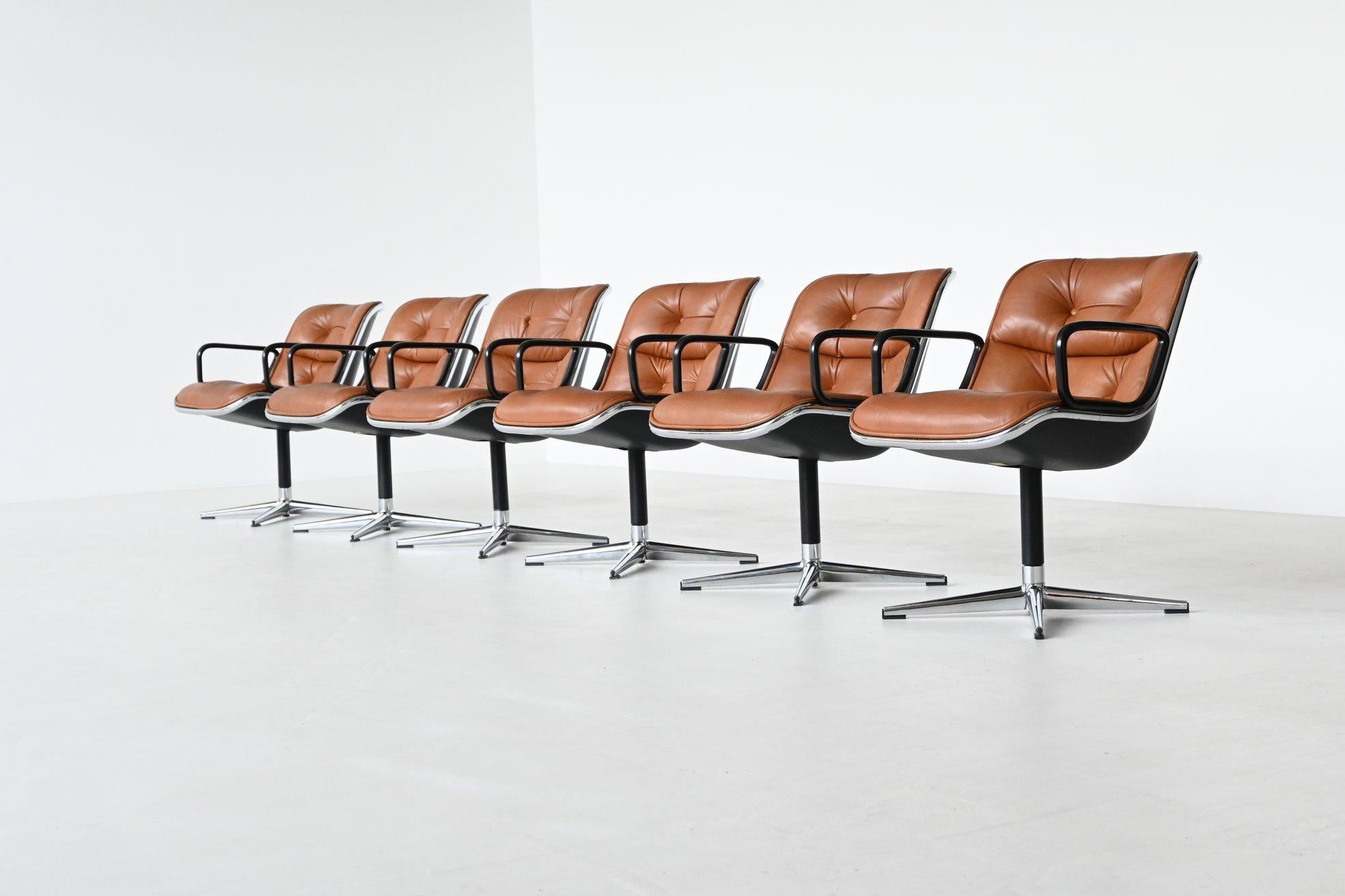 Very nice set of six executive office chairs designed by Charles Pollock and manufactured by Knoll International, United States 1963. These chairs are made of high quality cognac leather with a chrome plated rim and footrest. The seat and back are