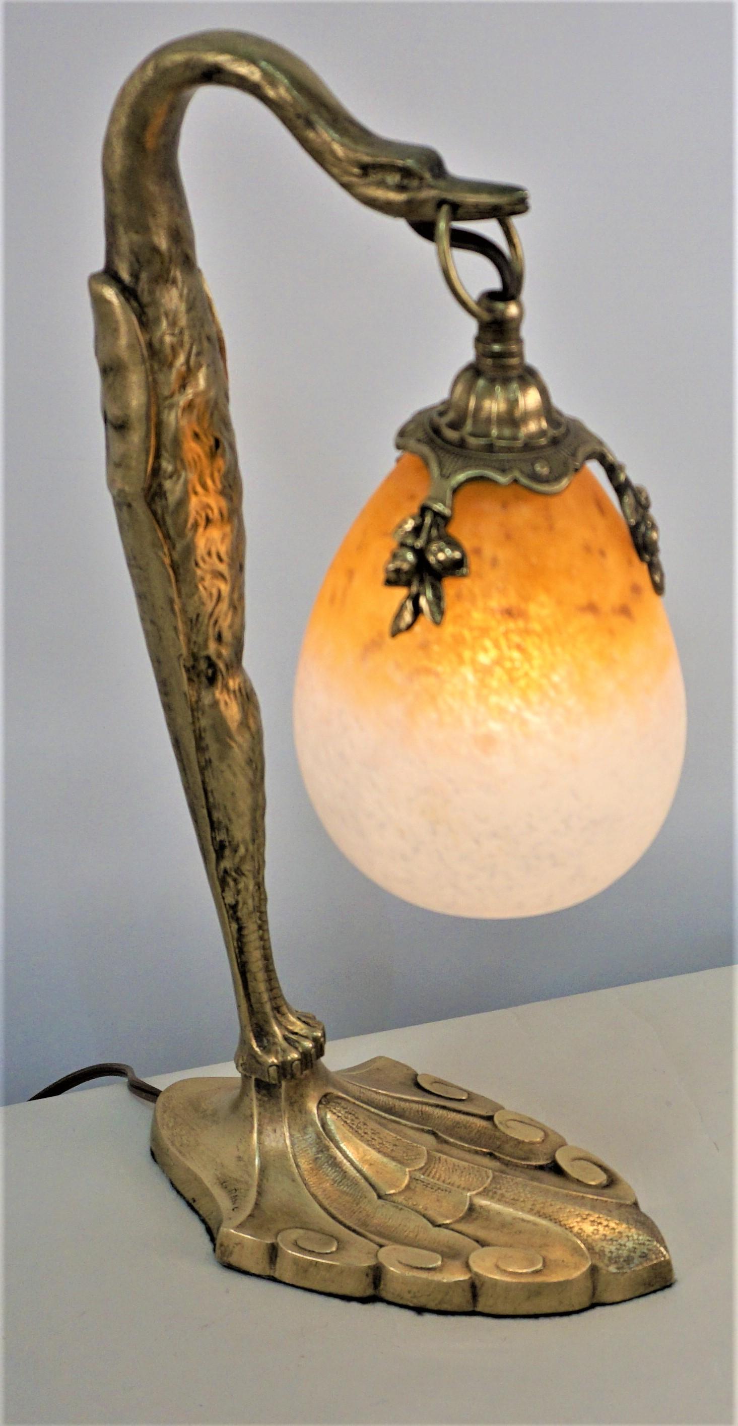 Beautiful bronze bird shape with blown glass shade table lamp by Charles Ranc